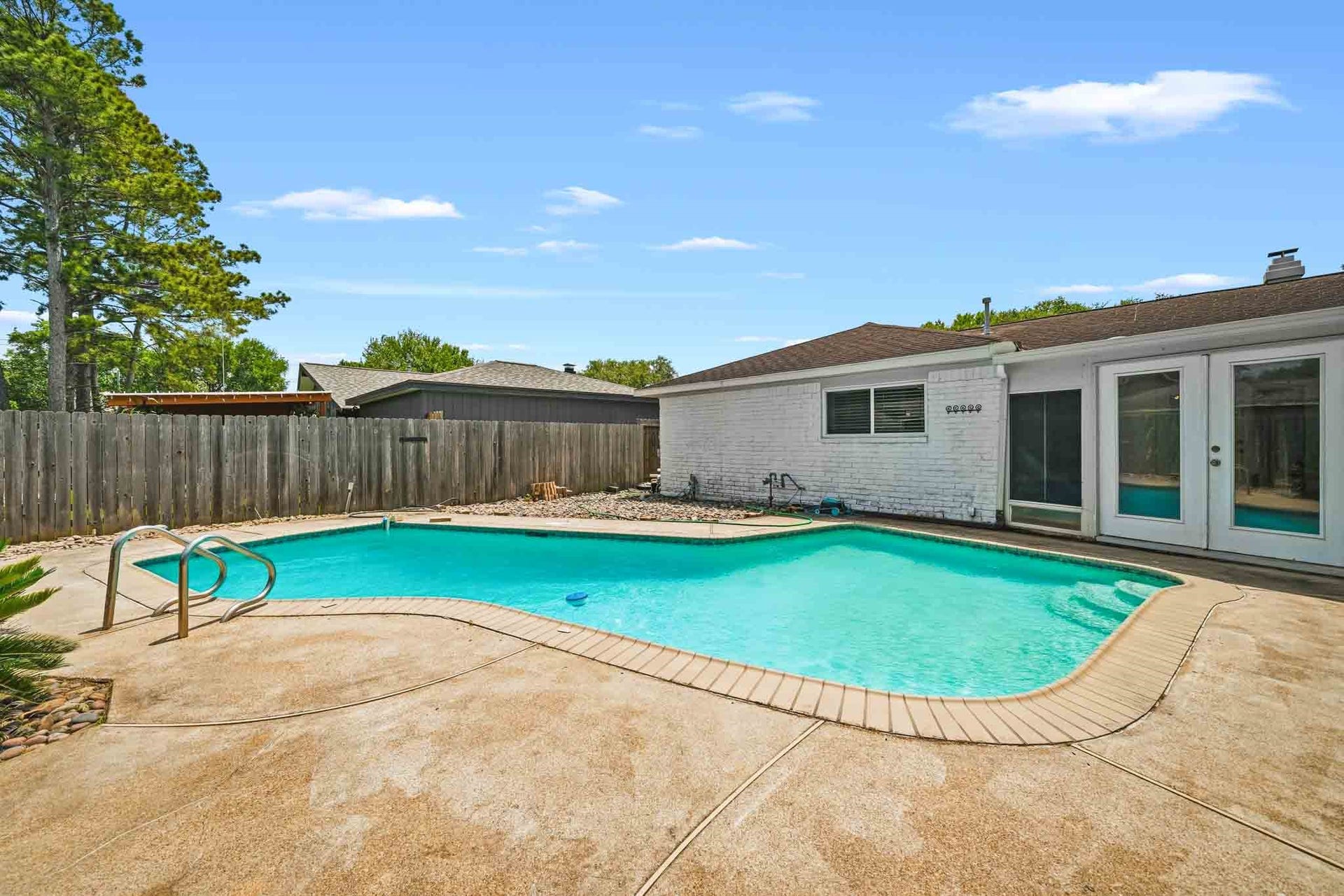 12010 Dorrance Lane, Meadows Place, TX 77477 This gleaming pool provides a wonderful spot to relax and beat the heat.