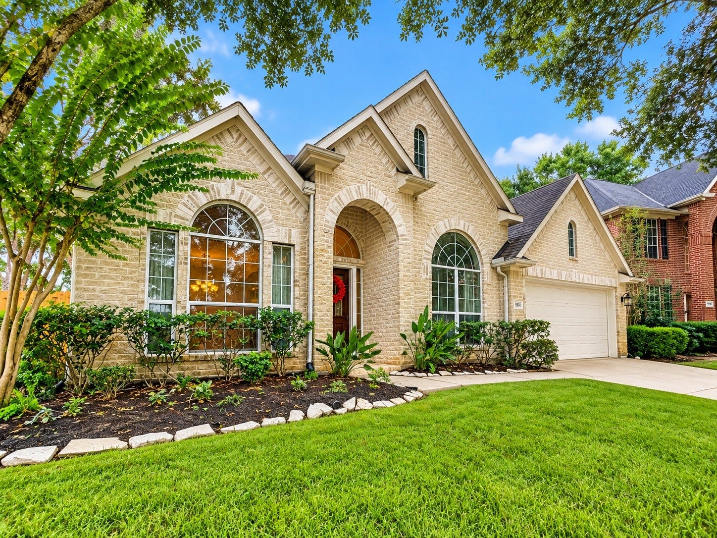 5810 Larch Leaf Lane, Richmond, TX 77469 Warm brick exterior, lush lawn, and graceful architectural details make a memorable first impression.