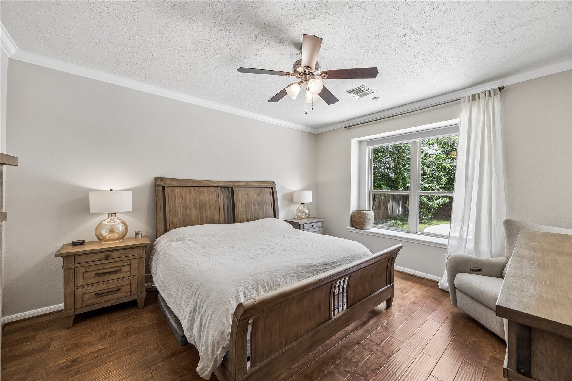 Spacious primary bath featuring dual vanities, a soaking tub, separate shower, and generous storage.