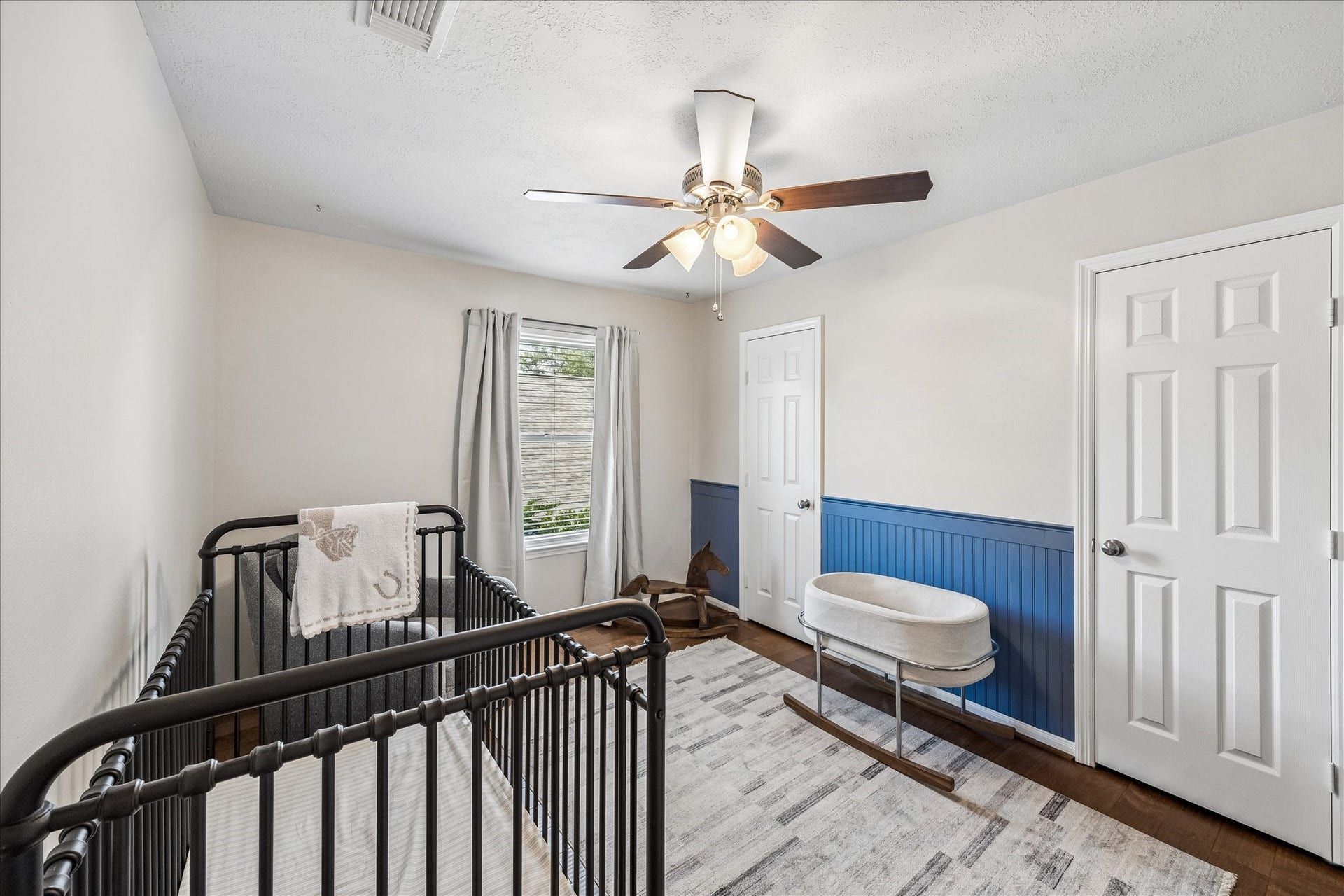 Secondary bathroom with granite countertops and tiled tub/shower surround.