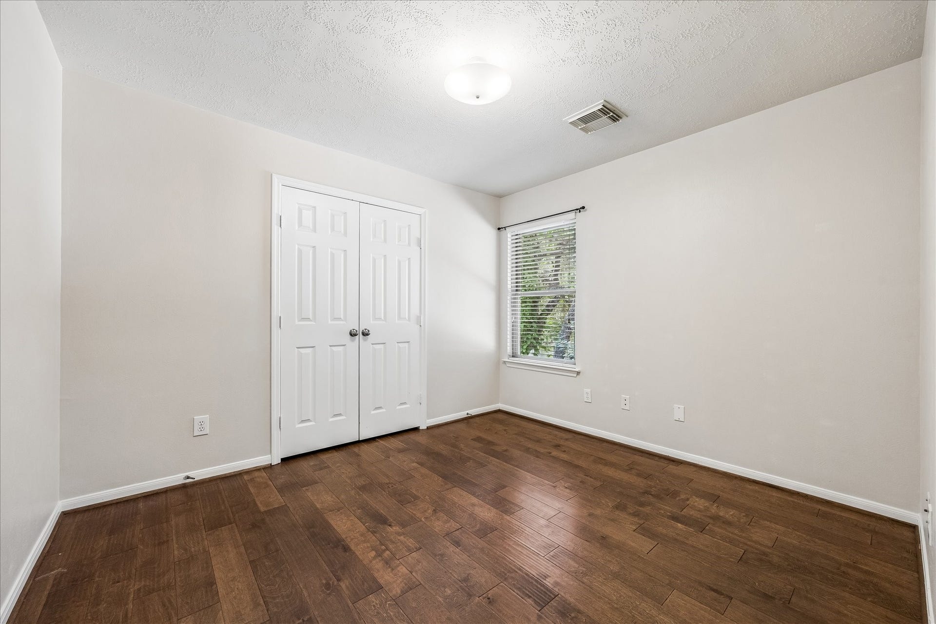 Large utility room with additional storage and convenient access for everyday functionality.
