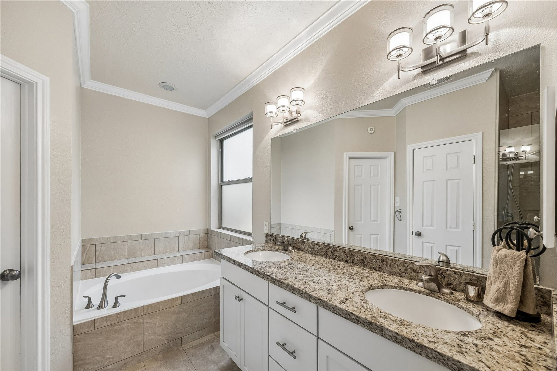 Versatile upstairs living area ideal as a game room, media space, home office, or study zone.