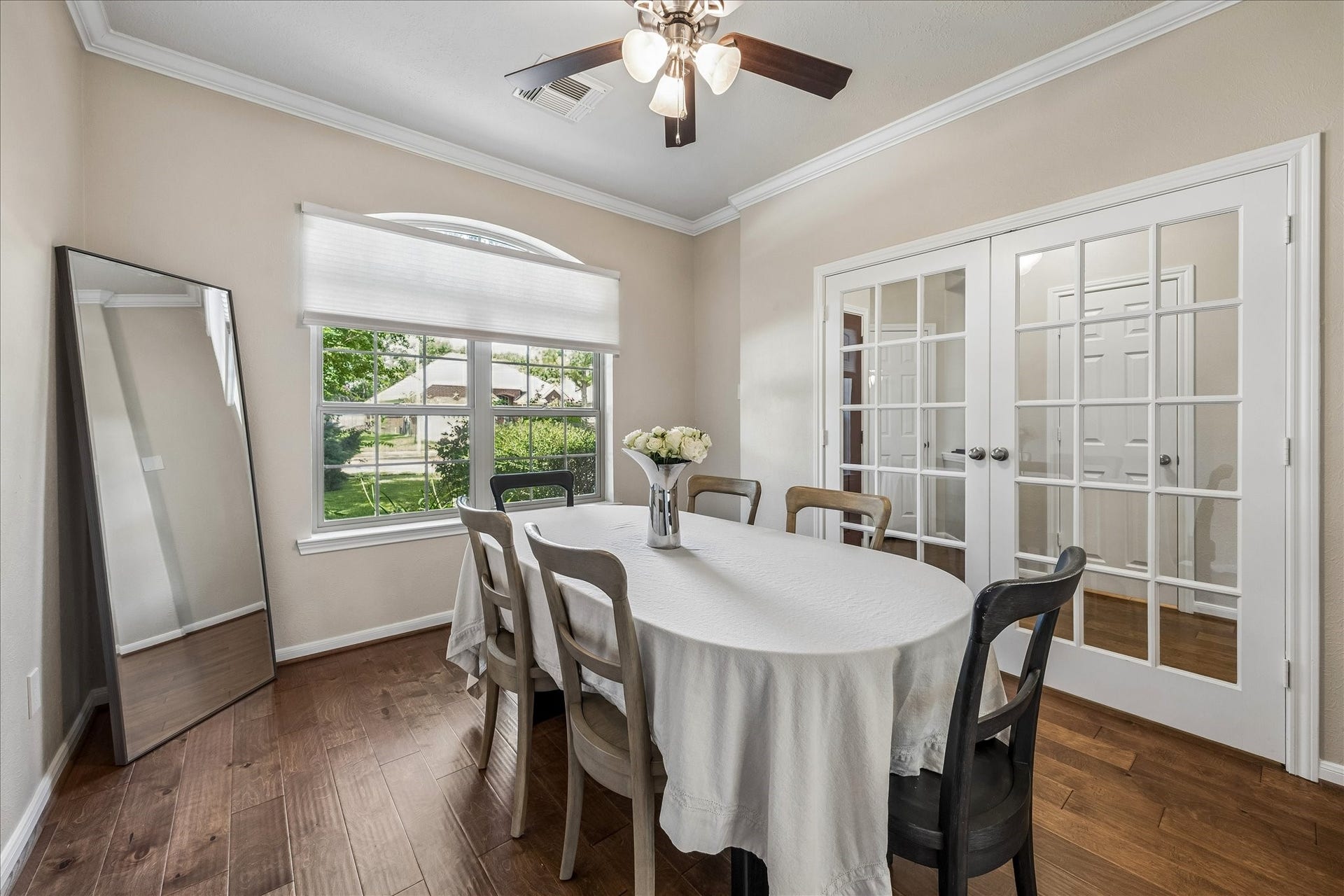 Convenient first-floor powder bath thoughtfully positioned in the front foyer for guests.