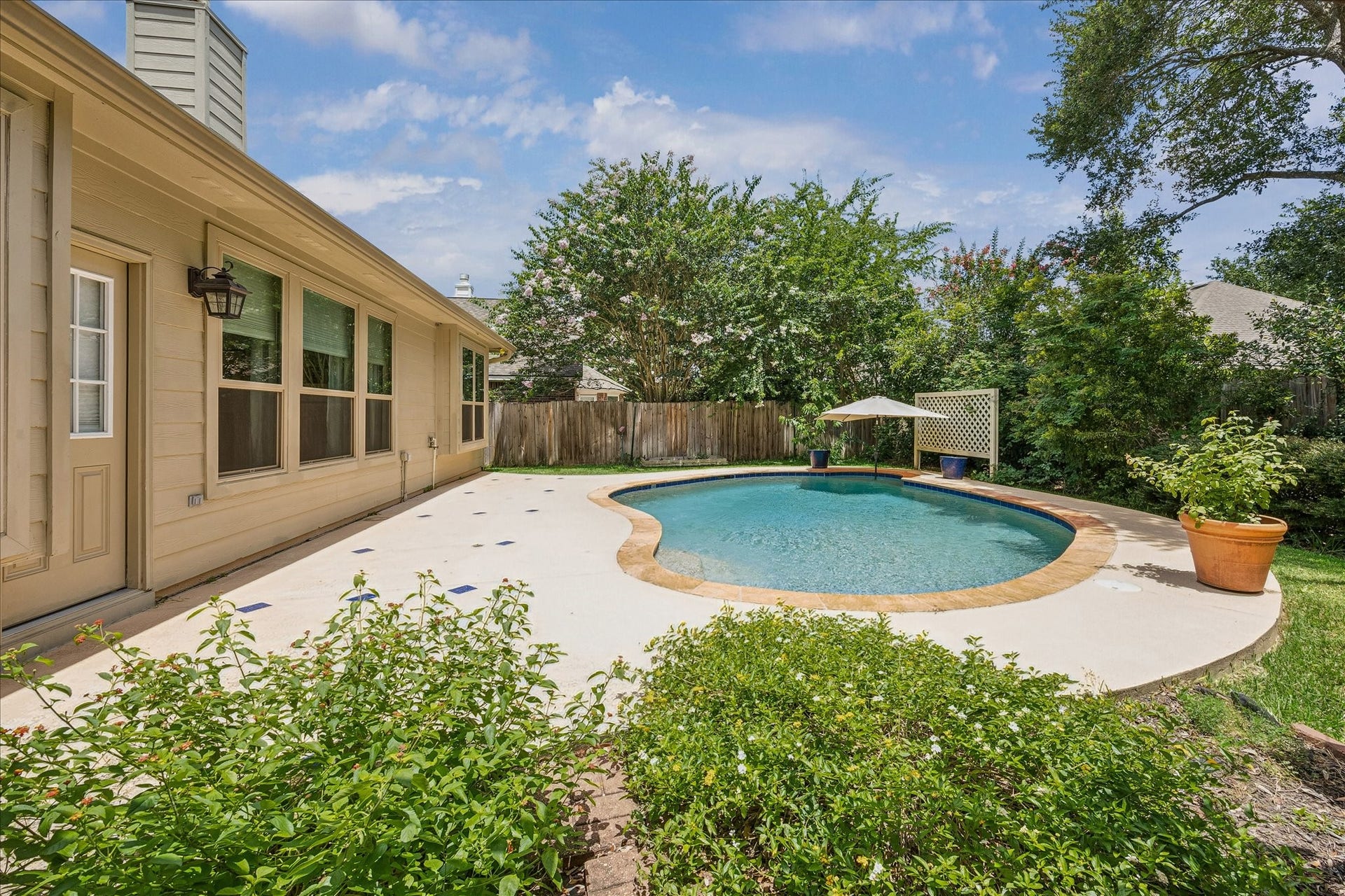 Expansive pool deck offers plenty of room for entertaining, sunbathing, and enjoying Houston's outdoor lifestyle.