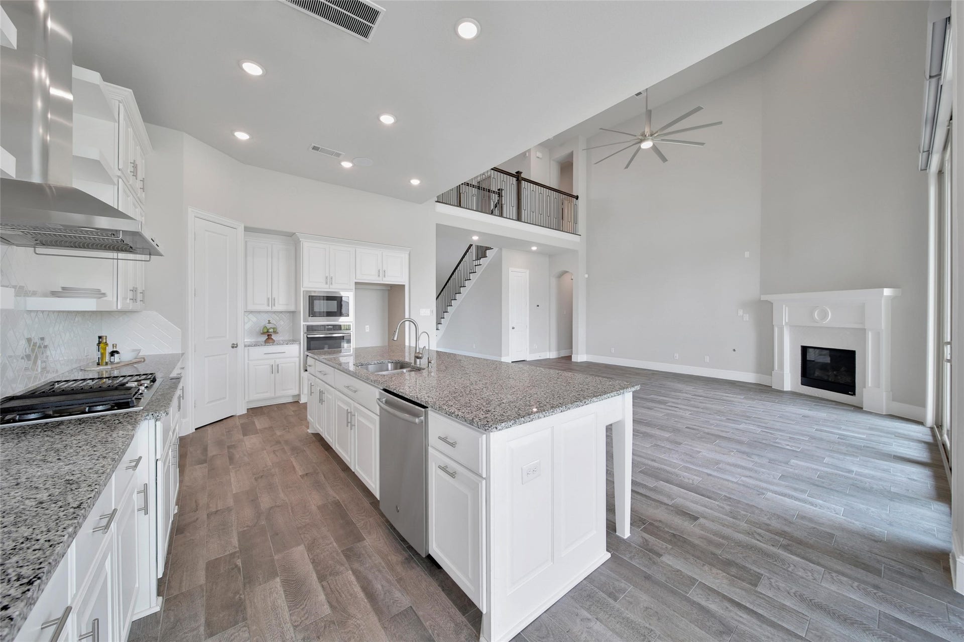 23935 Birchwood Lake Lane, Katy, TX 77493 The kitchen boasts a GE stainless steel appliance package, including a 36" gas cooktop, built-in oven, microwave, and dishwasher ensuring top tier performance. In addition, The kitchen and back patio are equipped with surround sound, enhancing entertainment both indoors and outdoors.