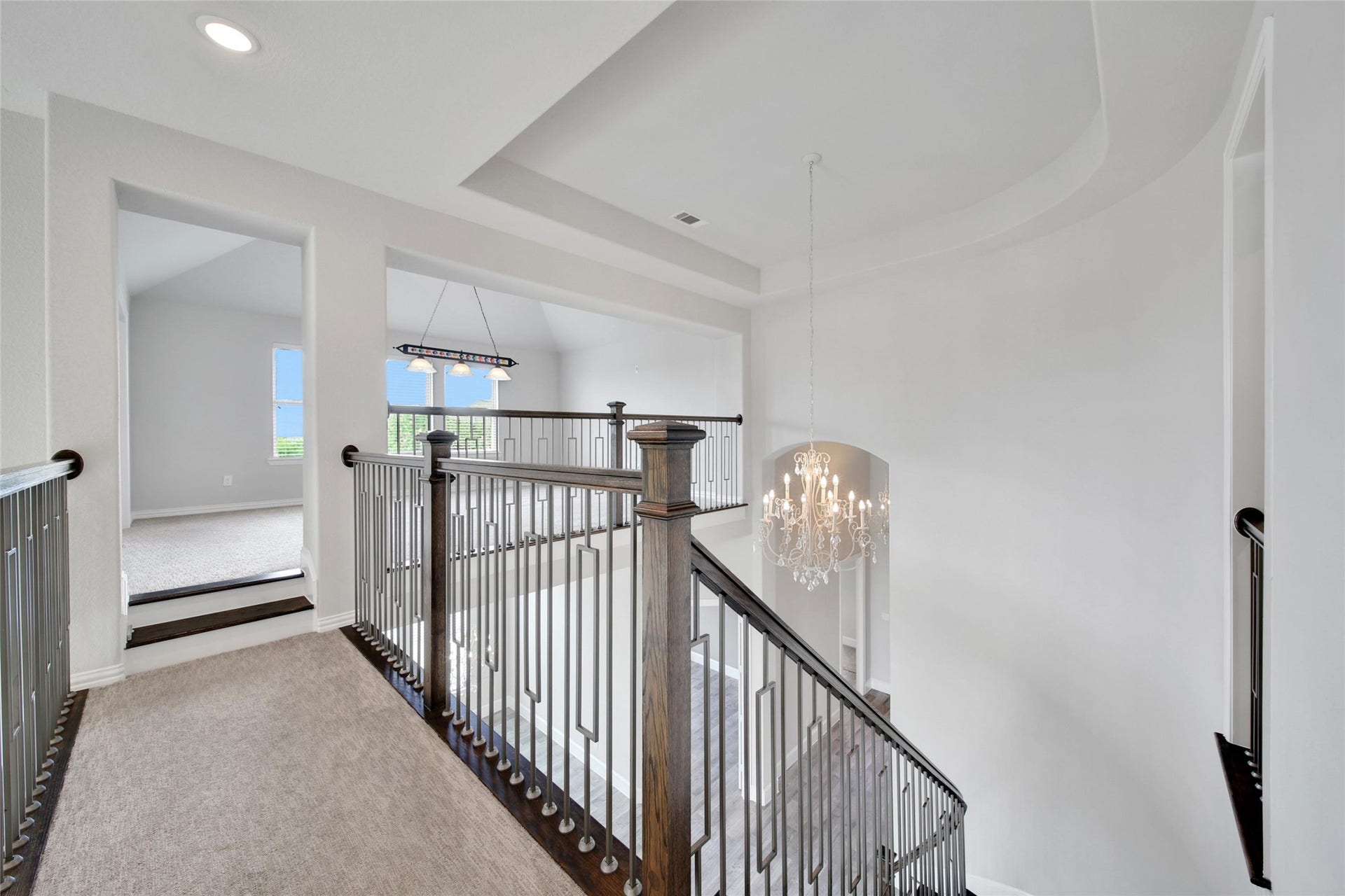 23935 Birchwood Lake Lane, Katy, TX 77493 The staircase is accented with sleek, modern wrought iron balusters for a stylish touch as well as wood treads with painted risers and subtle lighting along the lower walls for safe navigation in the dark.