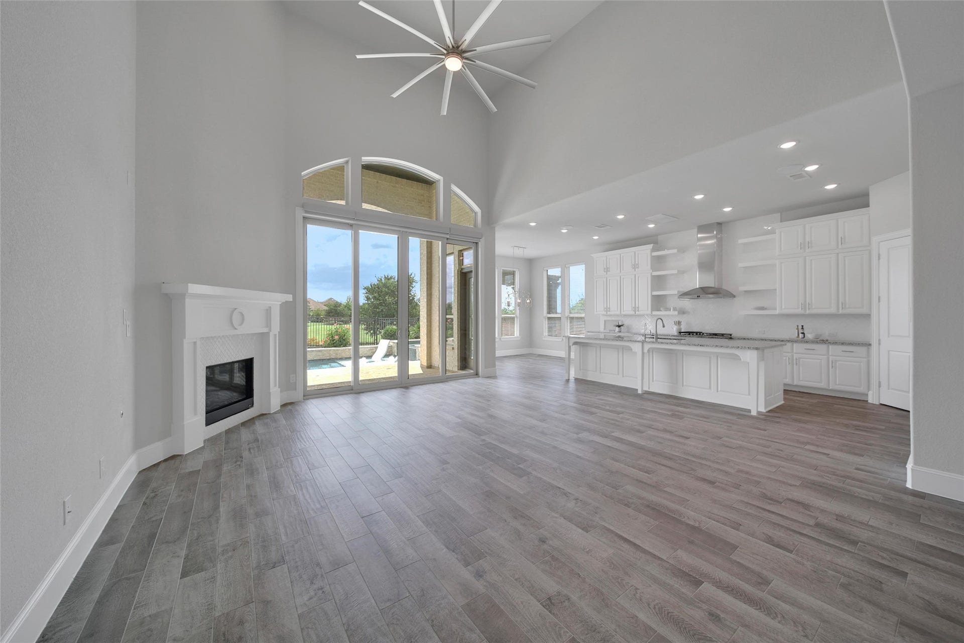 23935 Birchwood Lake Lane, Katy, TX 77493 The open-concept floor plan seamlessly connects the living, kitchen and casual dining areas, creating an inviting space for everyday living and entertaining.