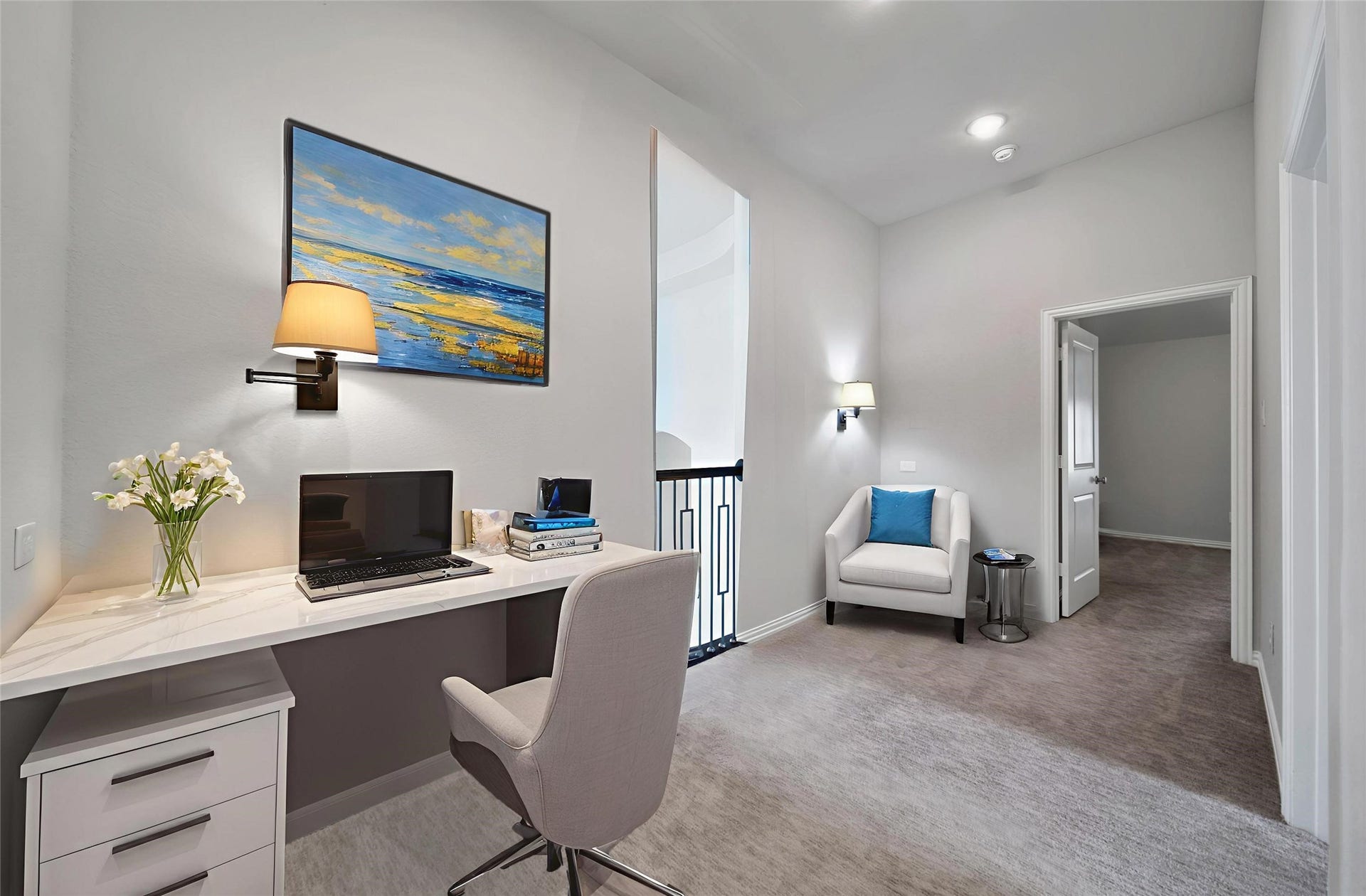 23935 Birchwood Lake Lane, Katy, TX 77493 The second-floor landing offers the perfect nook for hobbies or homework, providing a functional and flexible space. It has been virtually staged with two desks to showcase its potential.