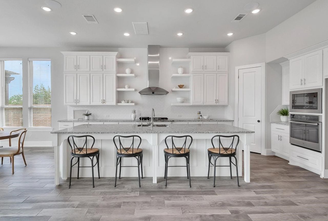 23935 Birchwood Lake Lane, Katy, TX 77493 Style meets function in this modern kitchen, featuring a large center island and abundant cabinet space. Rev-A-Shelf pull out organziers throughout the lower cabinets maximizes storage.