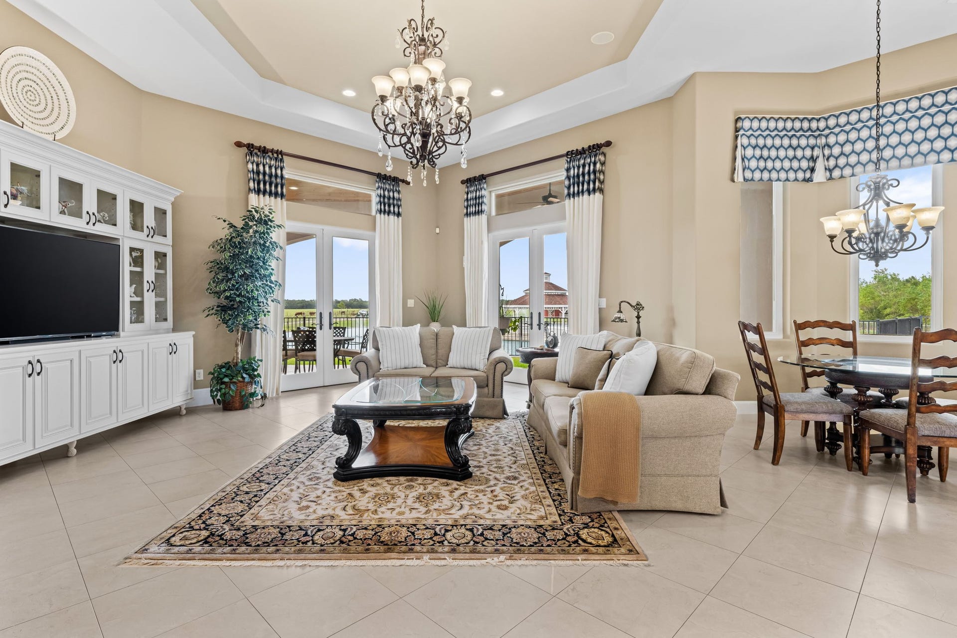 8145 Fm-1462, Rosharon, TX 77583 The den is oversized, but cozy with built-in entertainment center in French doors leading out to the back outdoor kitchen.