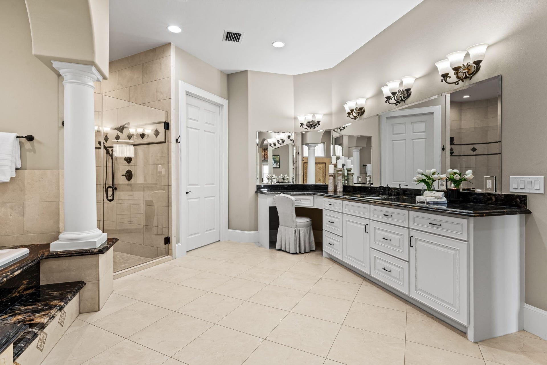 8145 Fm-1462, Rosharon, TX 77583 The grand primary en suite features, luxurious soaking tub, dual sinks with vanities, walk-in shower, and ample storage space.
