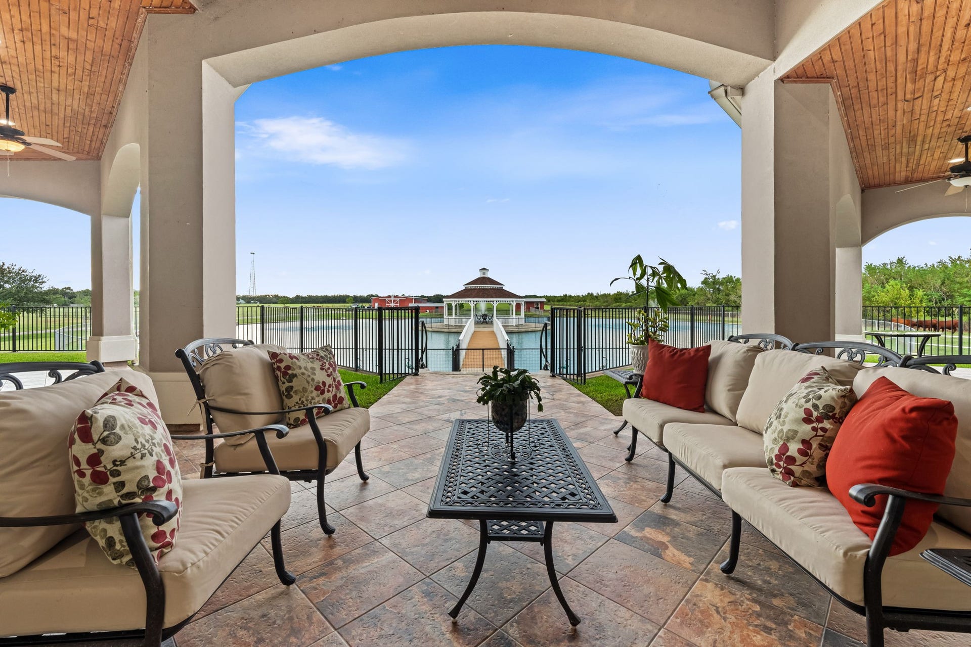 8145 Fm-1462, Rosharon, TX 77583 Throught the French doors you are on the expansive patio with views of the pond, pastures and livestock.