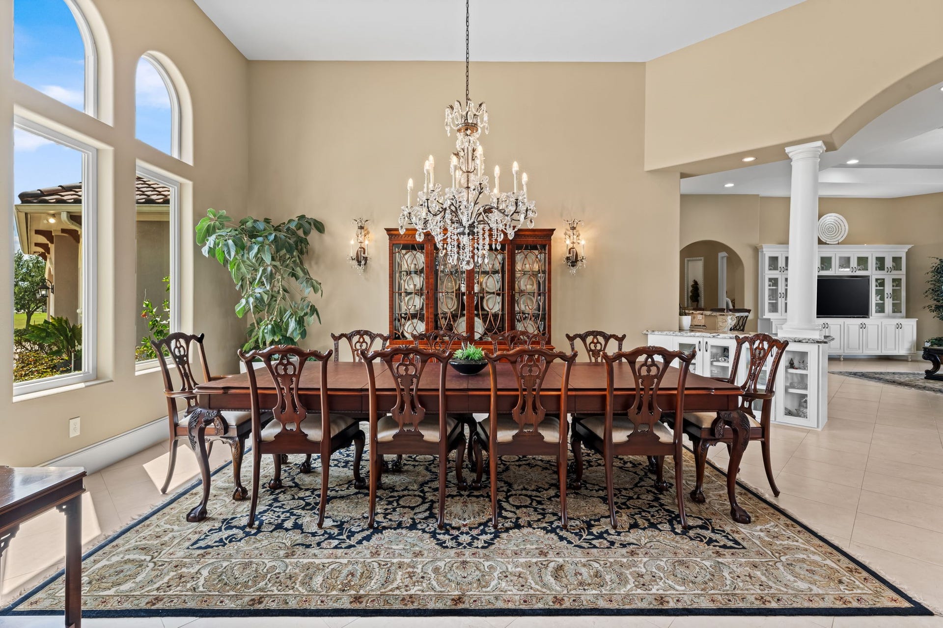 8145 Fm-1462, Rosharon, TX 77583 Elegant formal dining room highlighted by a stunning crystal chandelier. For added convenience, the home's chandeliers feature motorized lift systems, allowing them to be easily lowered for cleaning and bulb replacement.