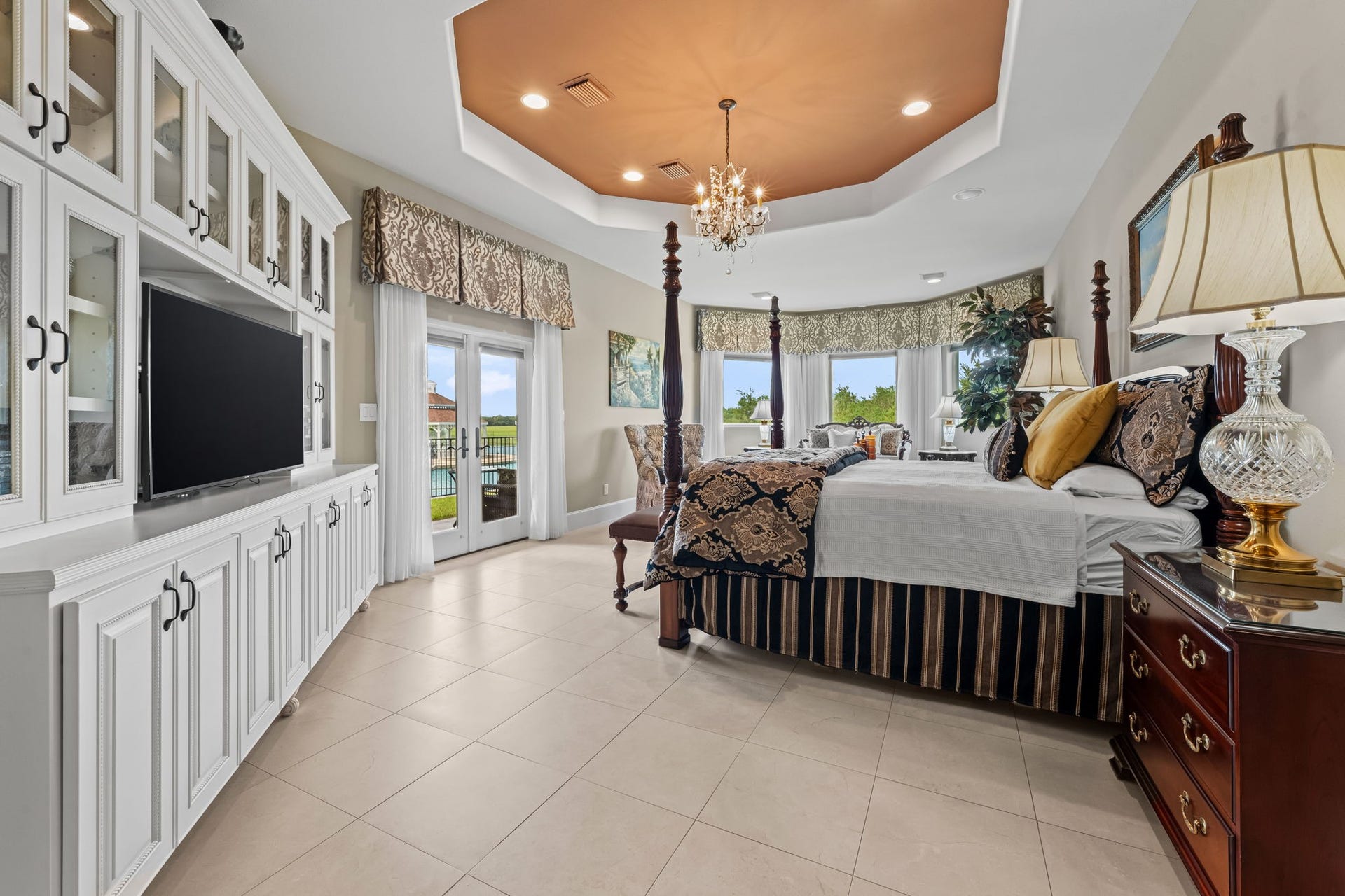 8145 Fm-1462, Rosharon, TX 77583 The primary suite features built-in Entertainment Center,, French doors leading out to a private patio, sitting area and a tray ceiling, making for an elegant, relaxing retreat.