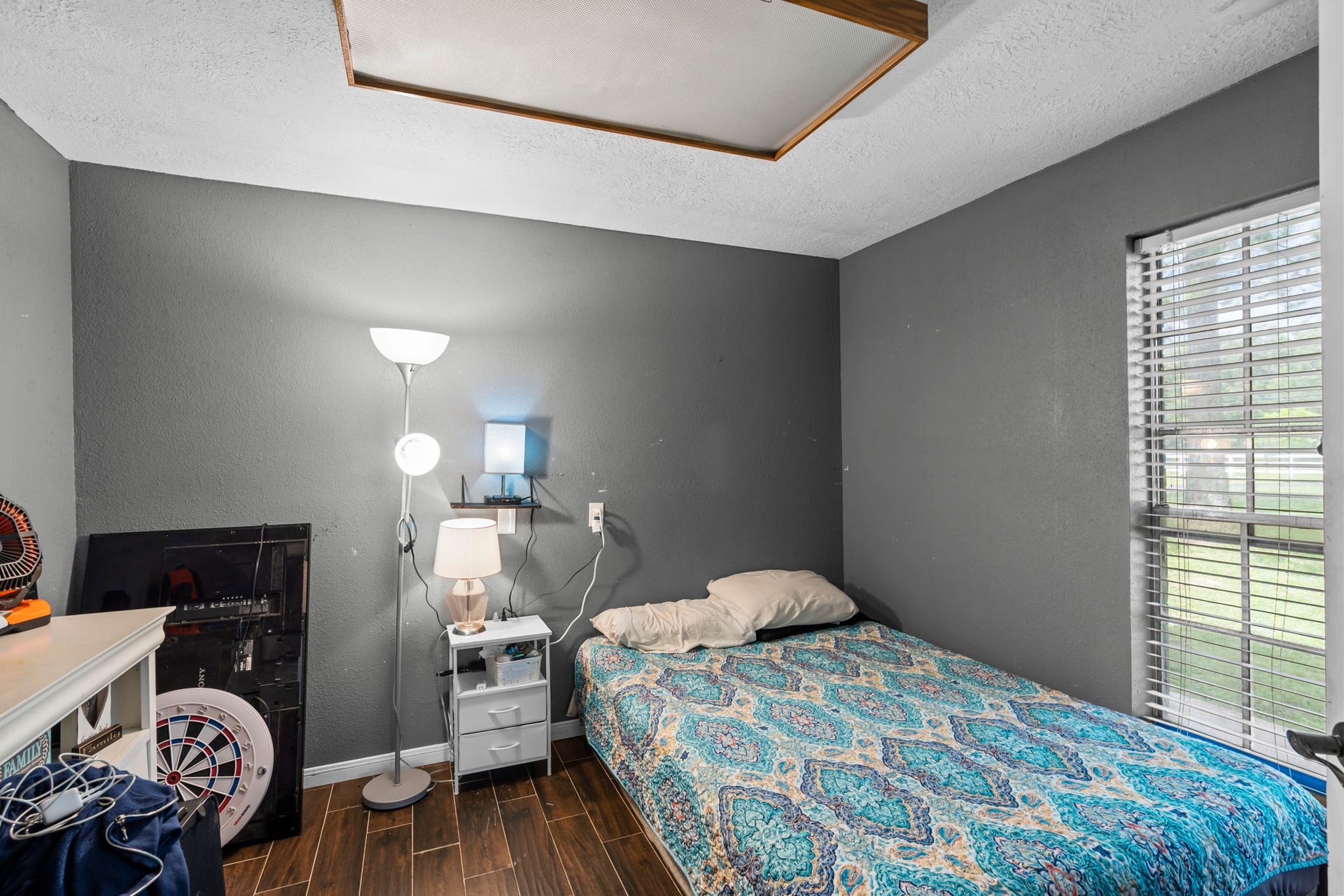 7009 Avenue R, Santa Fe, TX 77510 Downstairs bedroom but could also be office/flex room. Has 1/2 bathroom right before entrance.