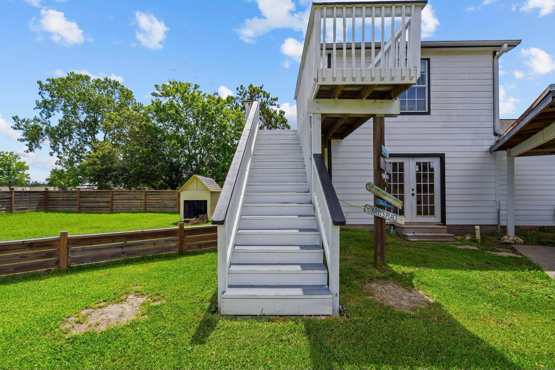 7009 Avenue R, Santa Fe, TX 77510 Stairs and deck to gameroom. French doors below are to the office and full bathroom.