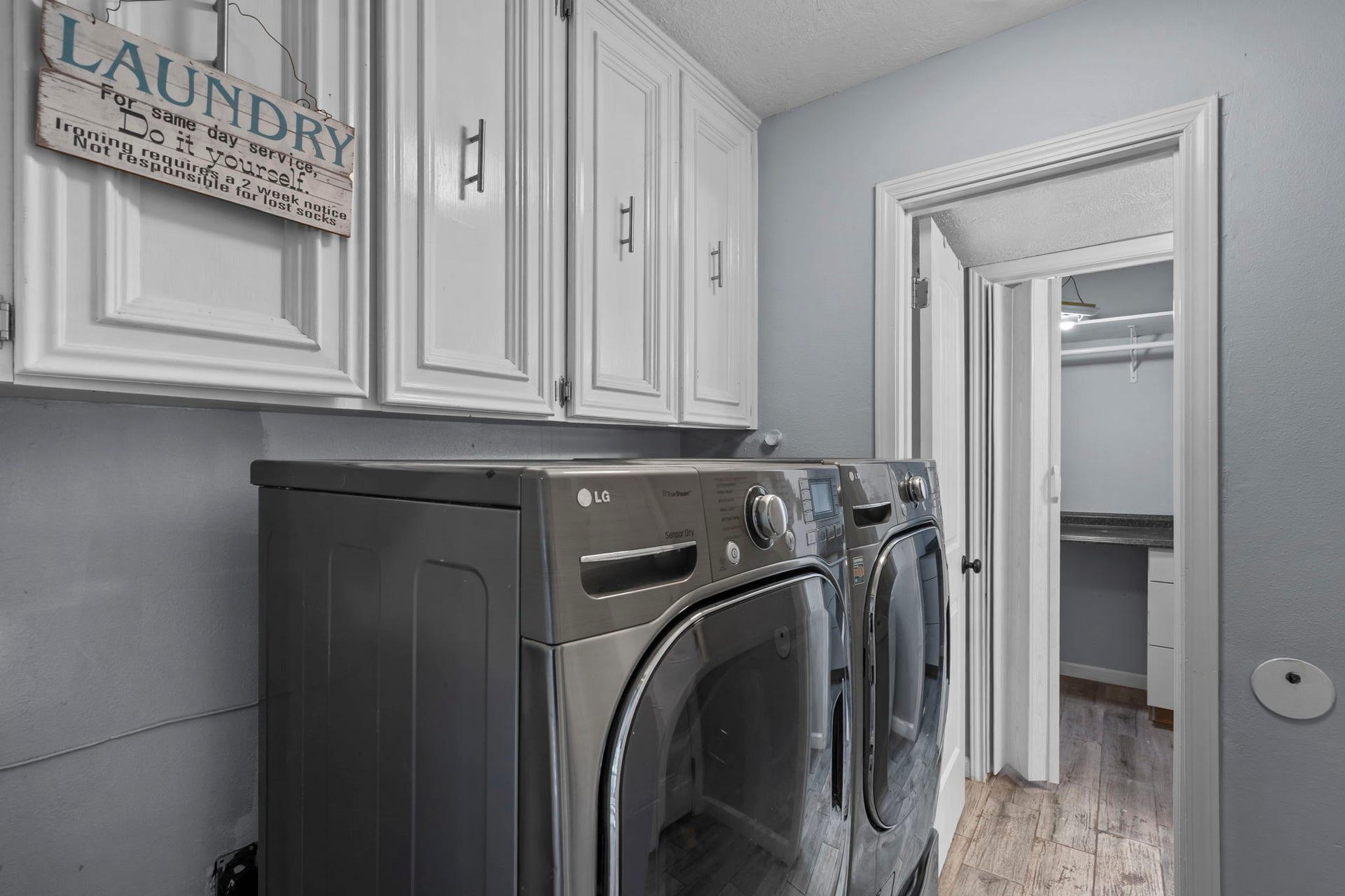 7009 Avenue R, Santa Fe, TX 77510 Utility room in the house with attached 1/2 bath and storage.