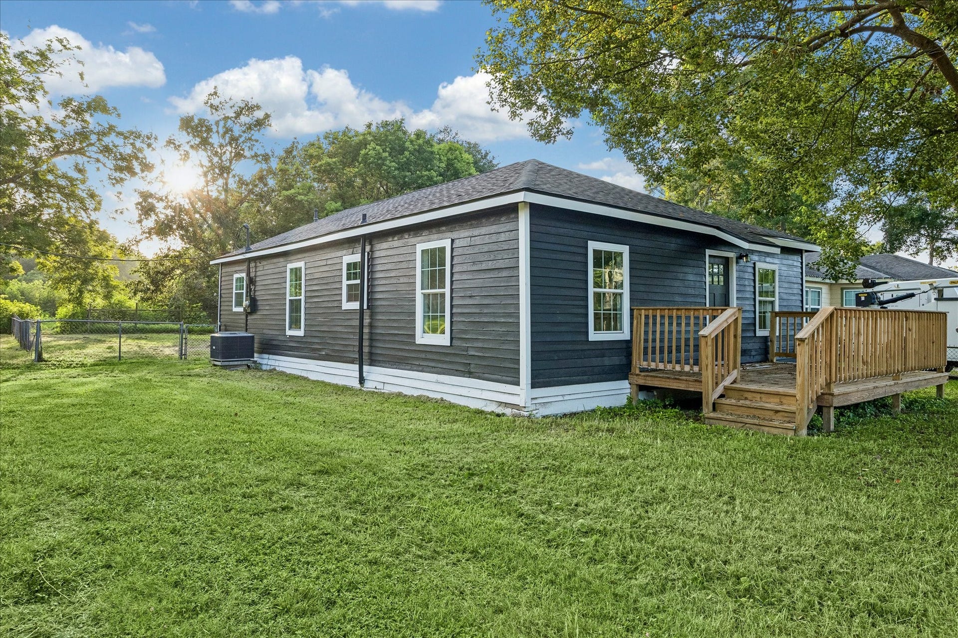 5122 Avenue L, Santa Fe, TX 77510 Fresh exterior paint, a new roof, and inviting front deck.