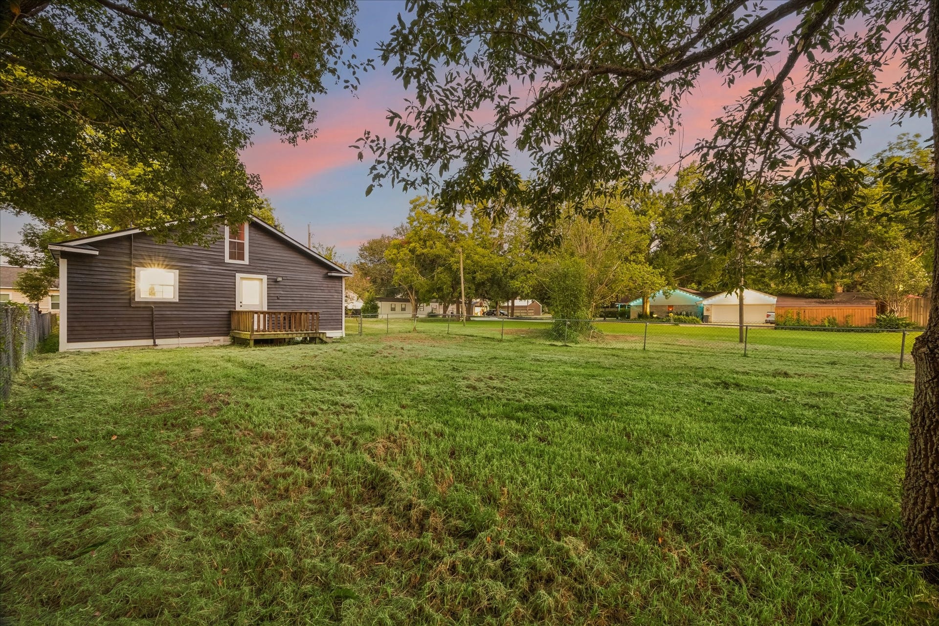 5122 Avenue L, Santa Fe, TX 77510 Peaceful backyard setting with mature trees and plenty of open lawn to enjoy.