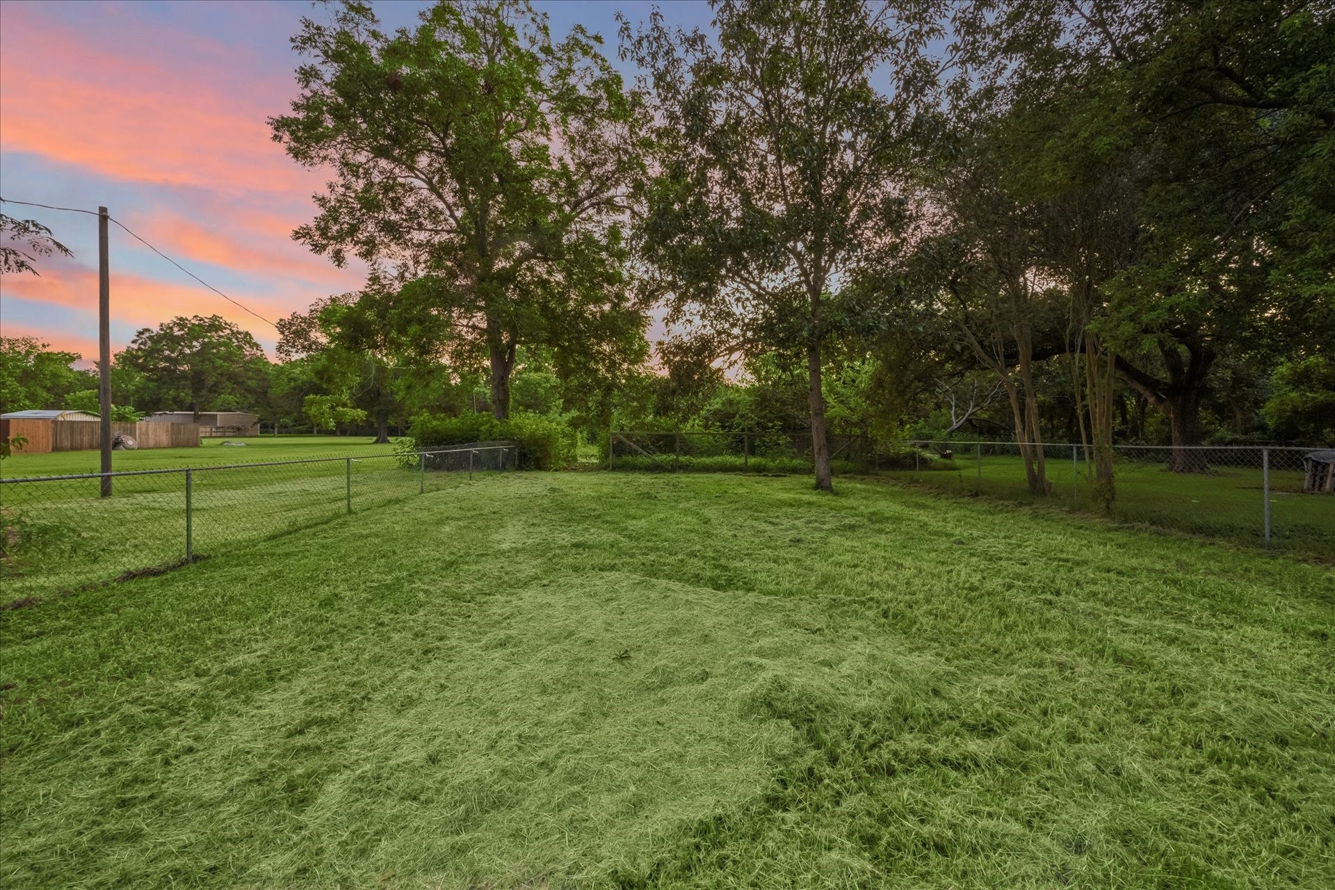 5122 Avenue L, Santa Fe, TX 77510 Expansive outdoor space. The rear 1/2 acre is also available for sale.