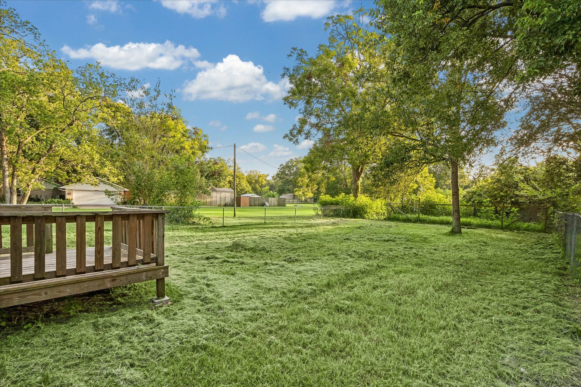 5122 Avenue L, Santa Fe, TX 77510 Enjoy wide-open lawn views from the back deck.