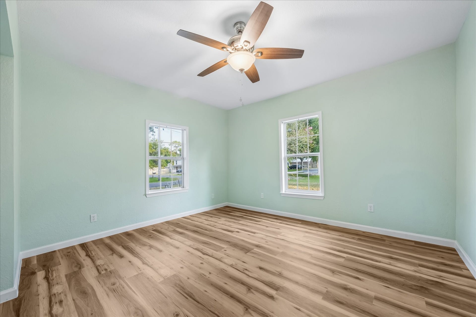 5122 Avenue L, Santa Fe, TX 77510 Second bedroom with updated finishes and generous space.