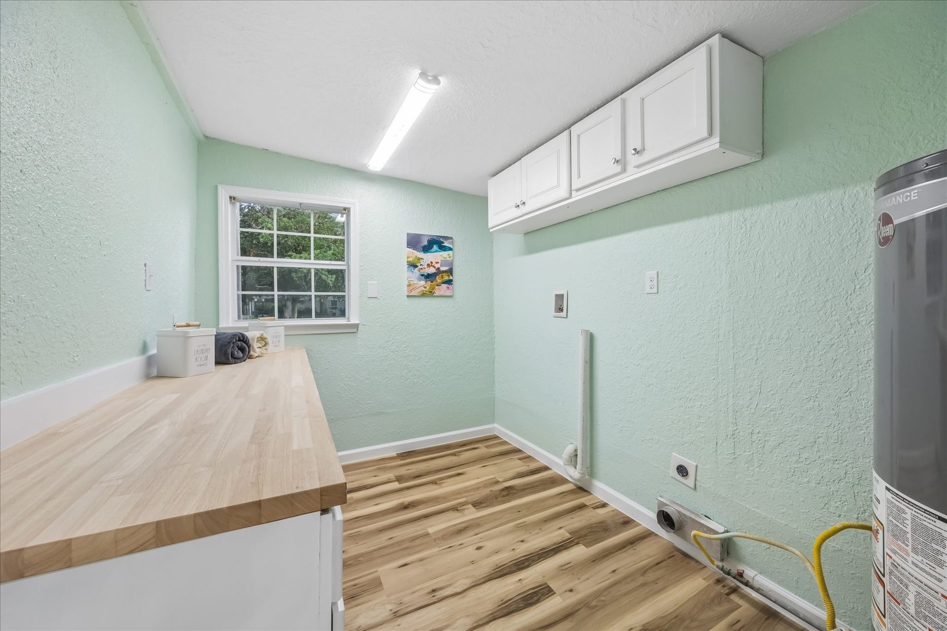 5122 Avenue L, Santa Fe, TX 77510 Reconfigured utility room with added countertop and storage.