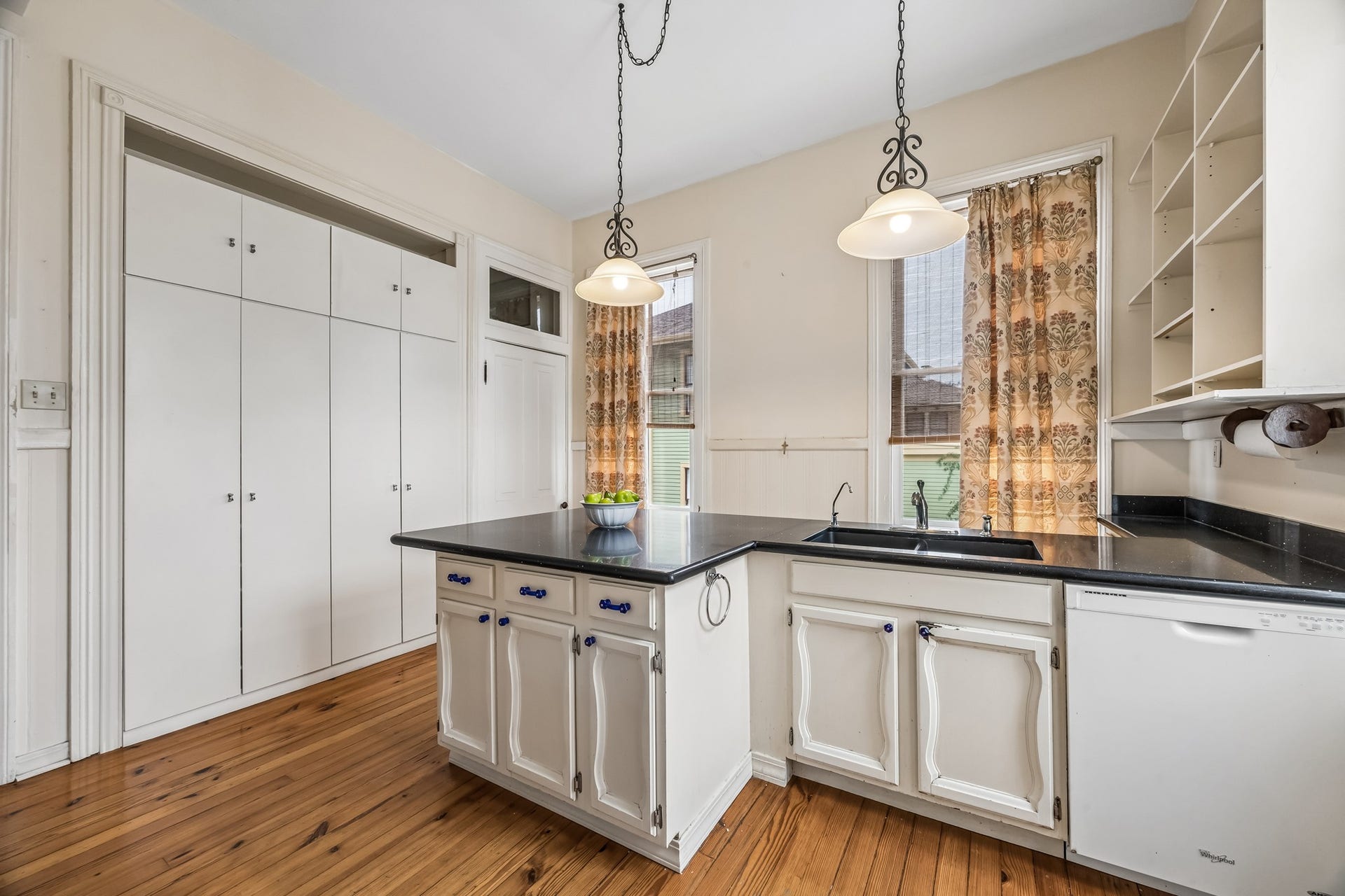 1818 Broadway Street, Galveston, TX 77550 The cabinets in the peninsula were vintage and salvaged when the kitchen was remodeled.