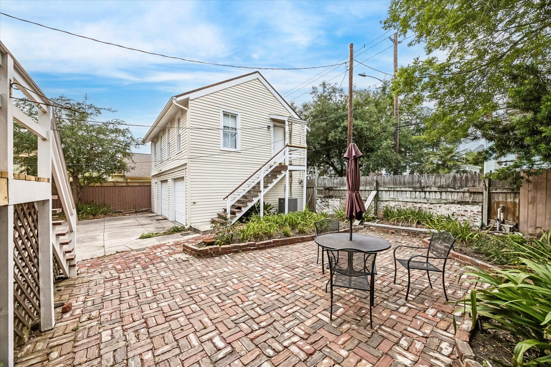 1818 Broadway Street, Galveston, TX 77550 Large patio with vintage brick and a lovely garden. Perfect for enjoying a cup of tea or a glass of wine.