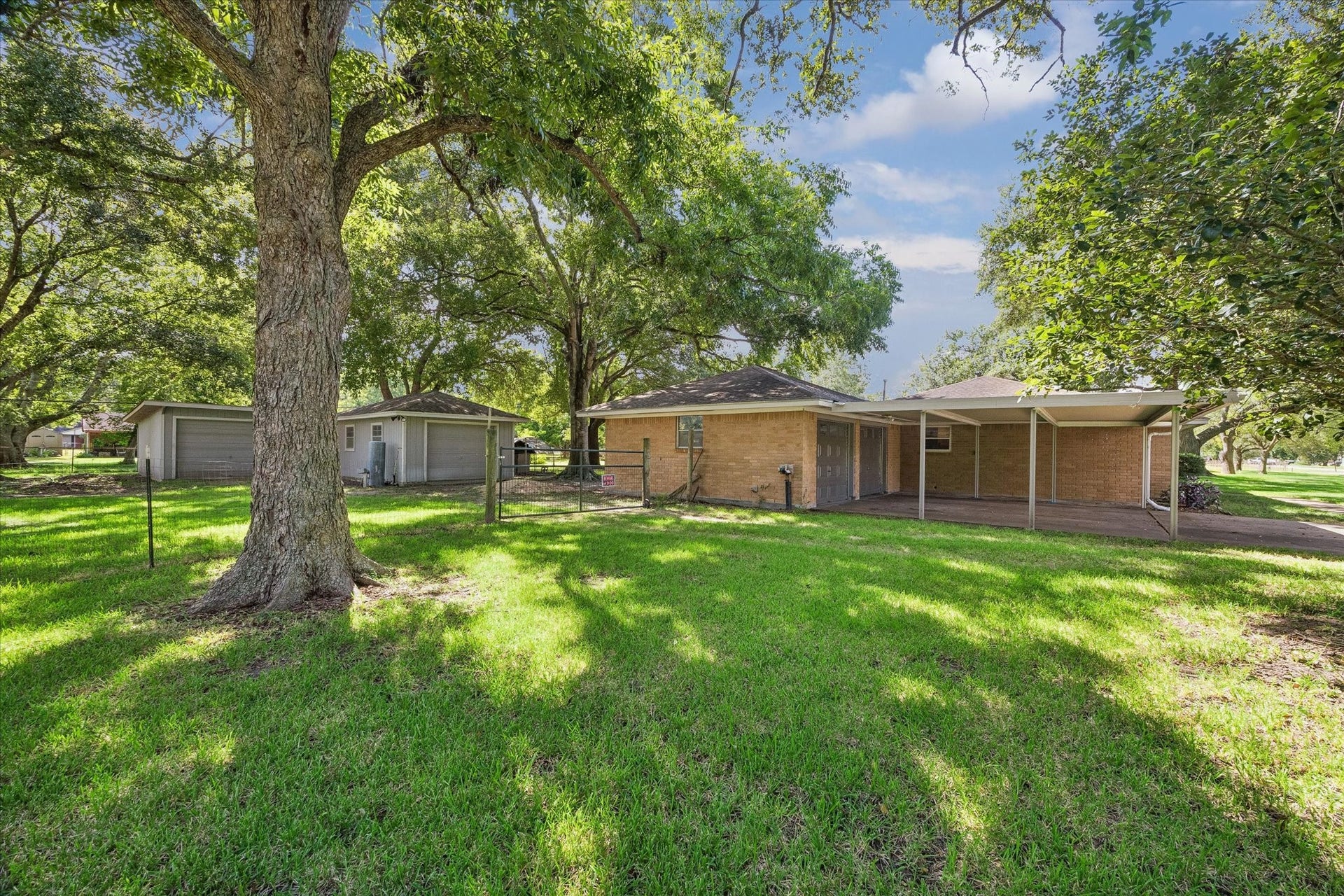 12511 Britt Road, Pearland, TX 77584 The mature trees in front and back supply a wealth of shade for outdoor entertaining.