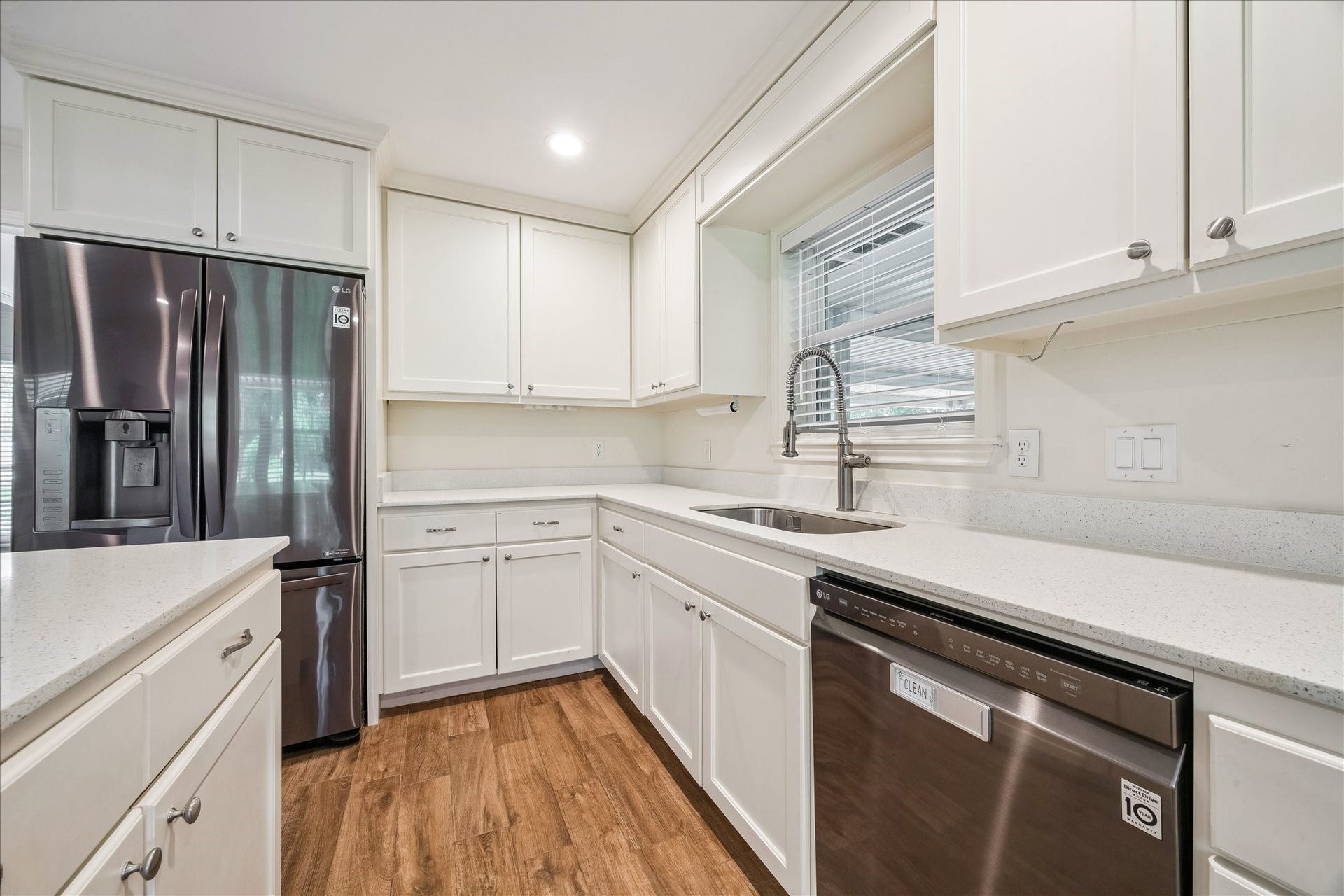 12511 Britt Road, Pearland, TX 77584 Quartz counters, clean white shaker cabinets and stainless sink round out this gorgeous kitchen.
