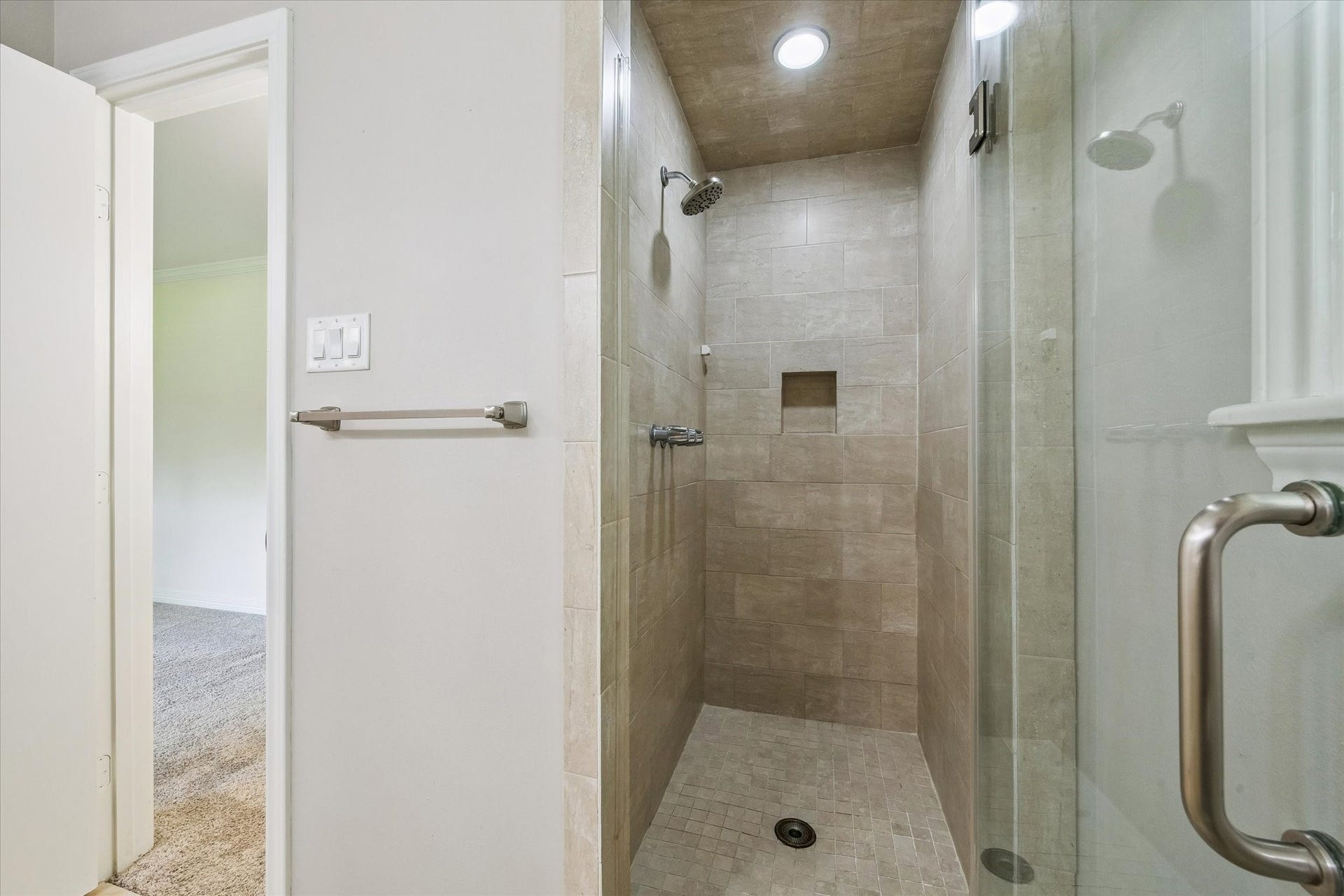 12511 Britt Road, Pearland, TX 77584 Tiled shower area with a spotless glass door and recessed lighting.