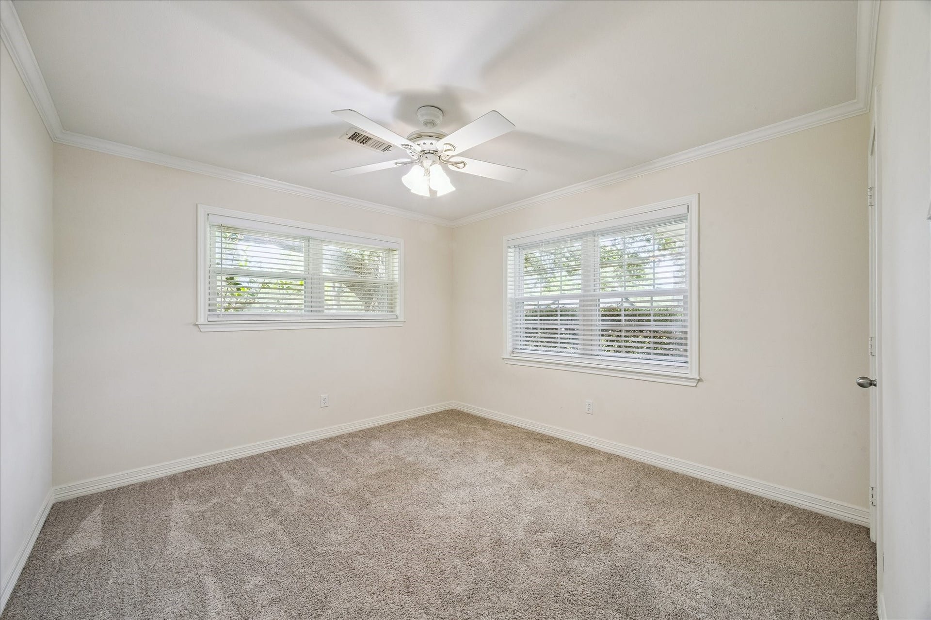 12511 Britt Road, Pearland, TX 77584 Bedroom 2 located on the front corner of the house with two windows.