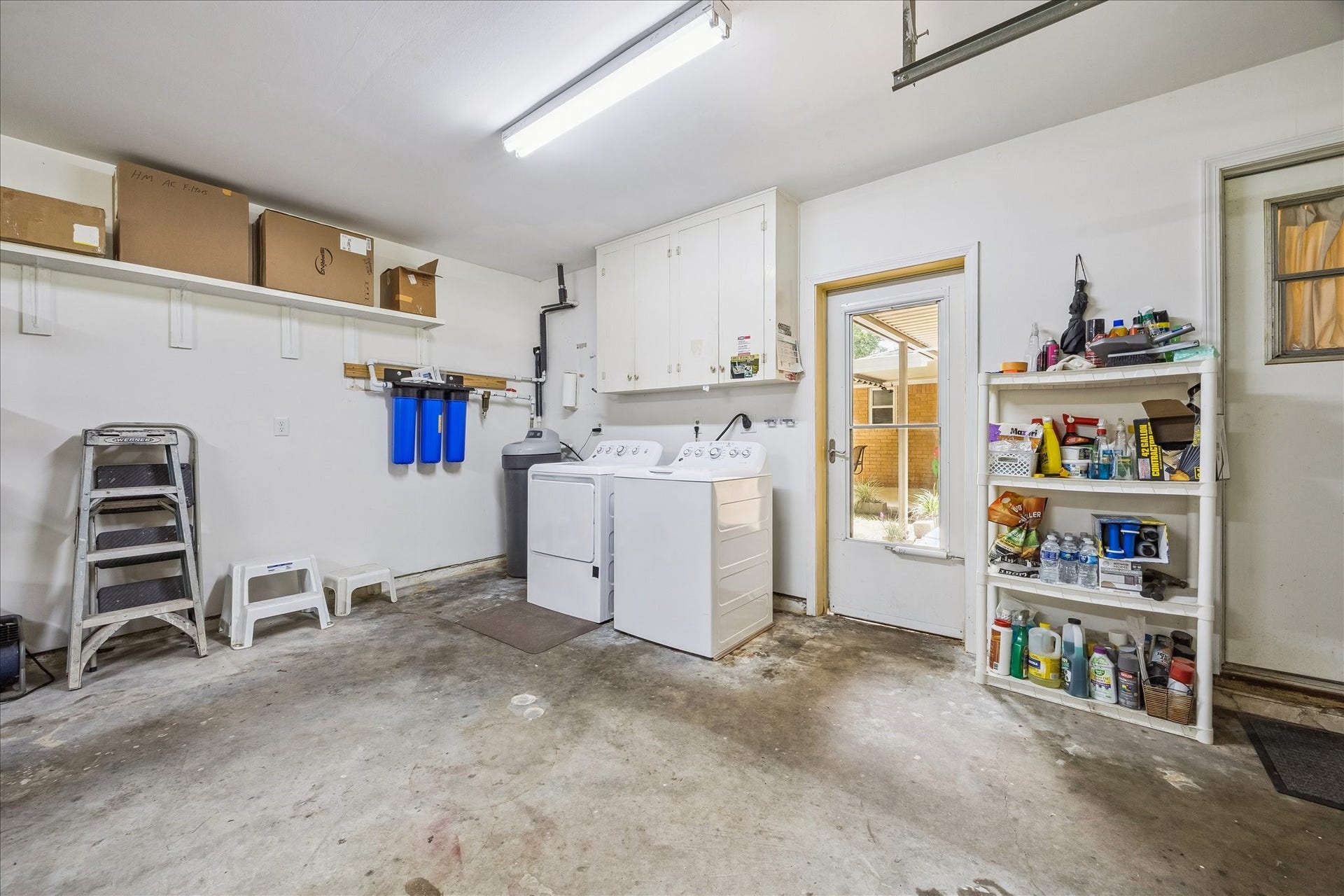 12511 Britt Road, Pearland, TX 77584 Utility room in the garage, door leads to back porch area.