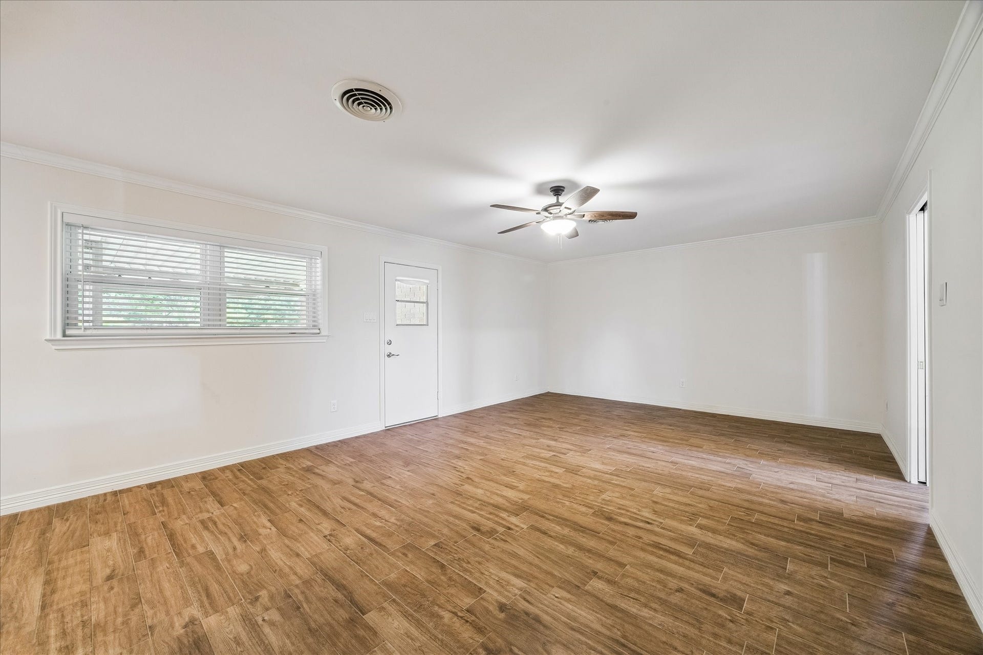 12511 Britt Road, Pearland, TX 77584 Den has back porch access and spotlights the beautiful ceramic hand-scrapped wood-look tile flooring that is located throughout all living areas.