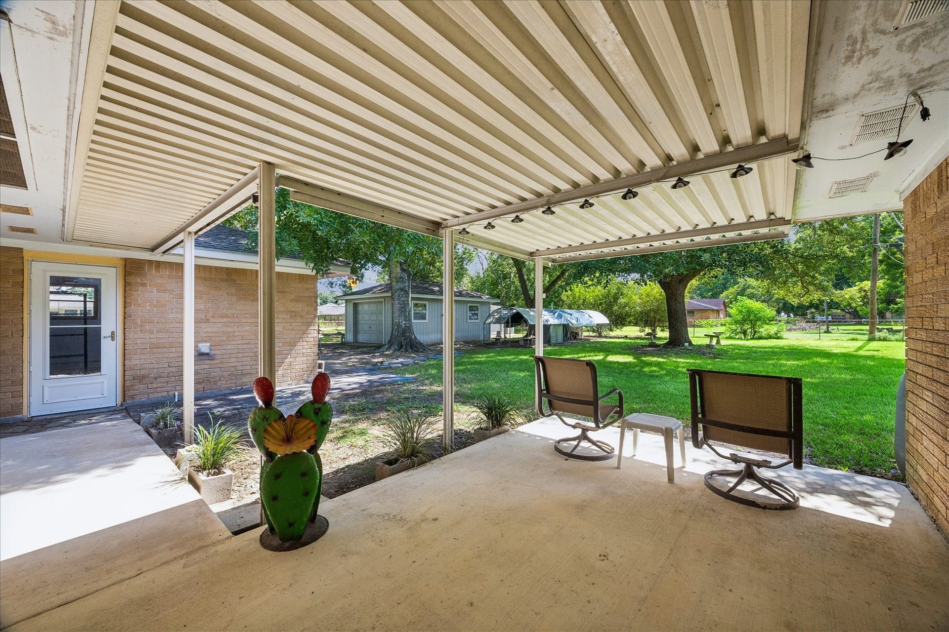 12511 Britt Road, Pearland, TX 77584 The serenity this place offers is front and center on the covered back porch.