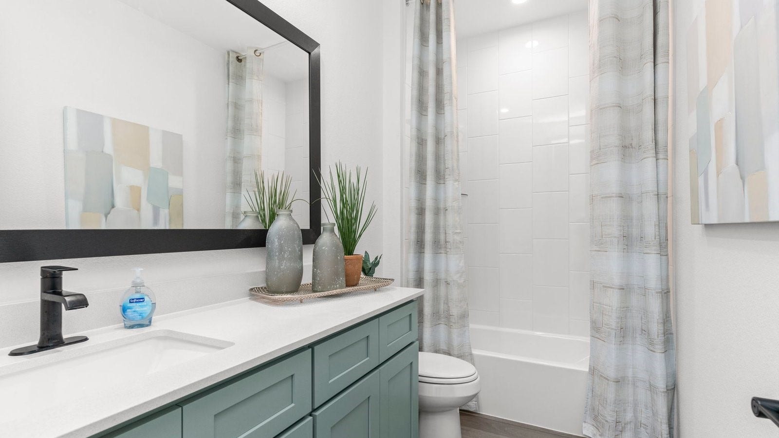 secondary bathroom with a standing tub