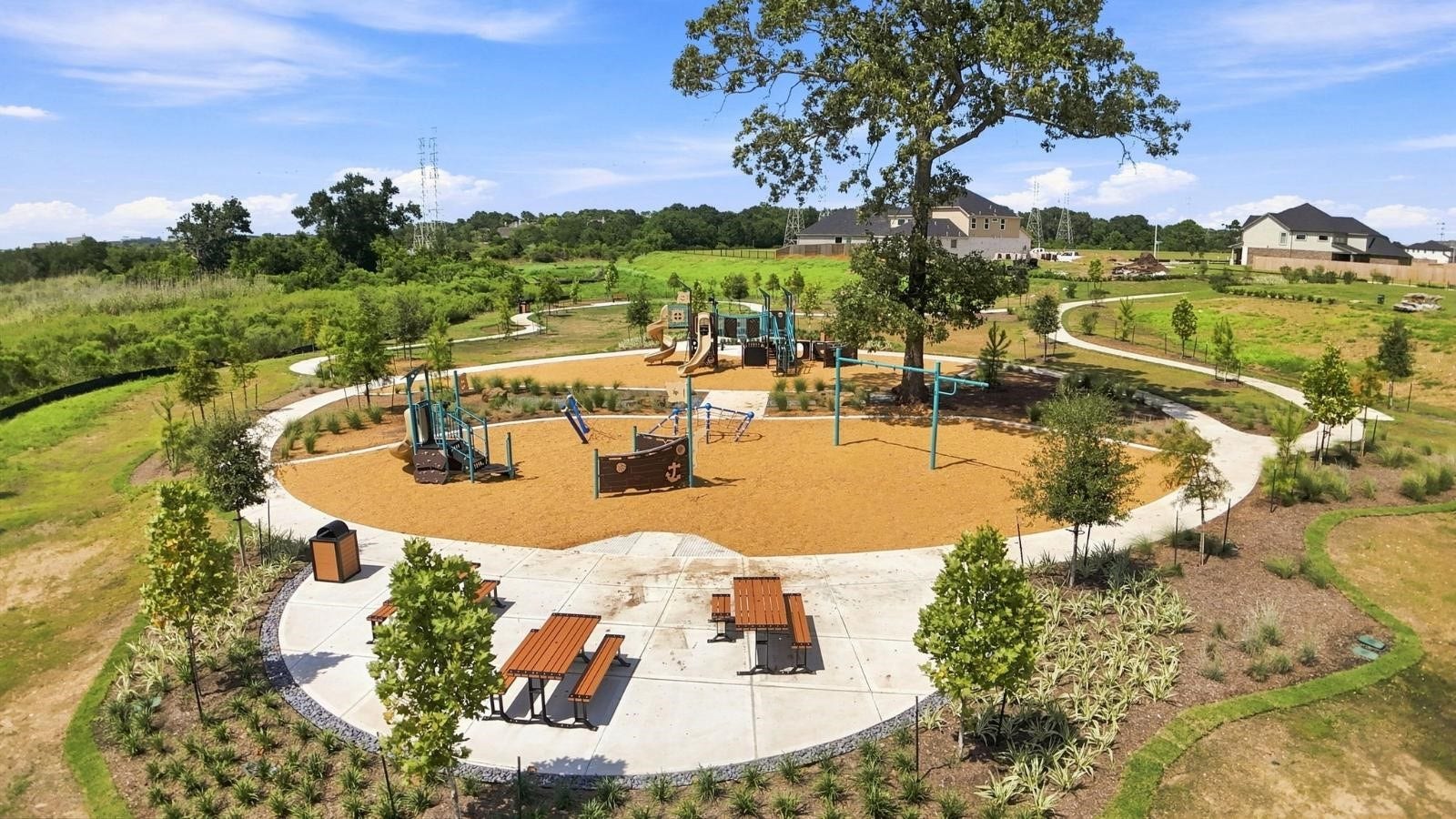 community park with a playground and picnic tables