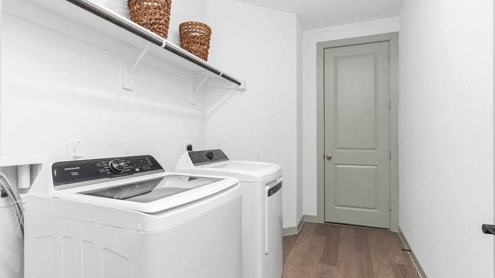 laundry room with a hanging rod and shelf
