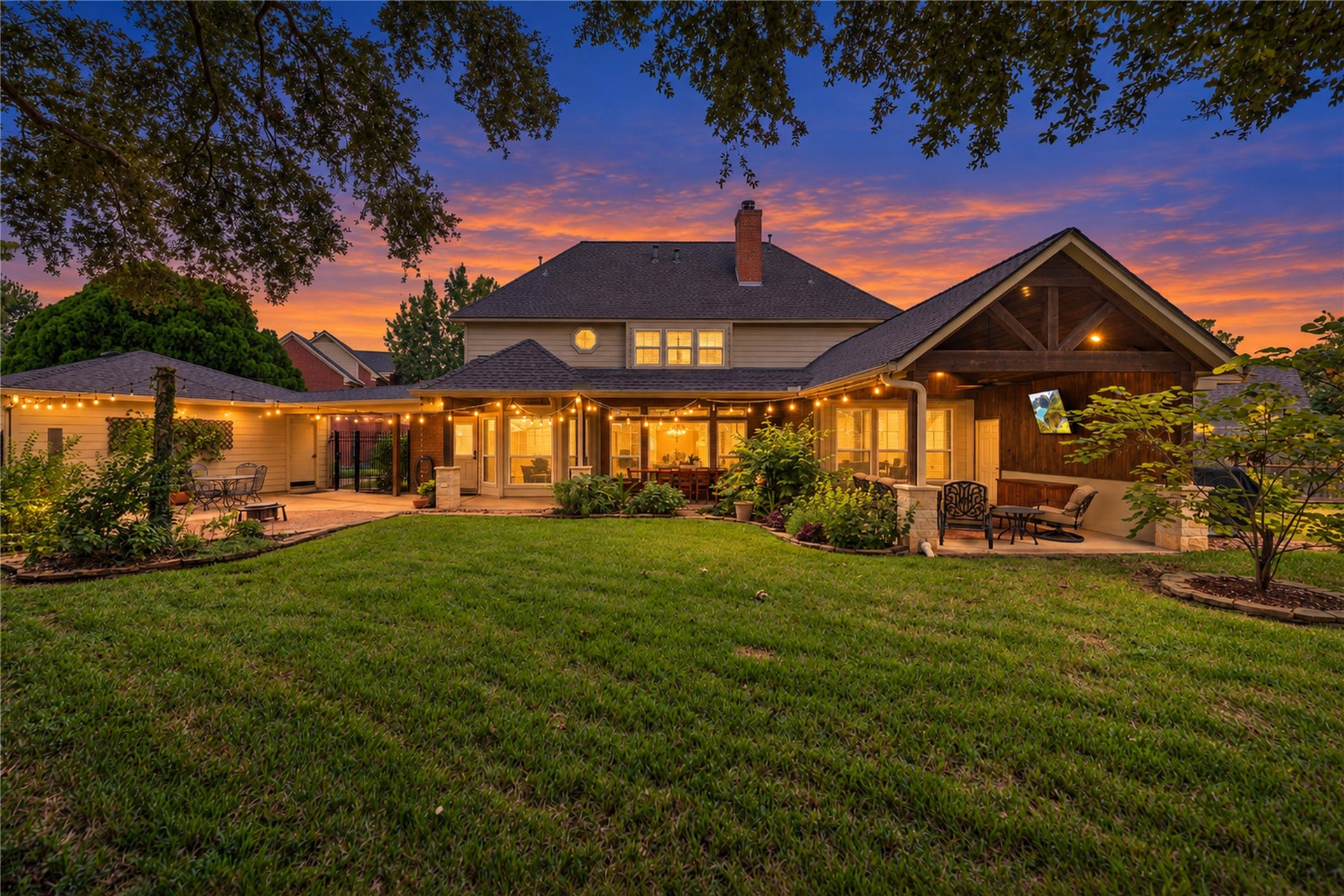 Experience serene evenings in this stunning backyard oasis.