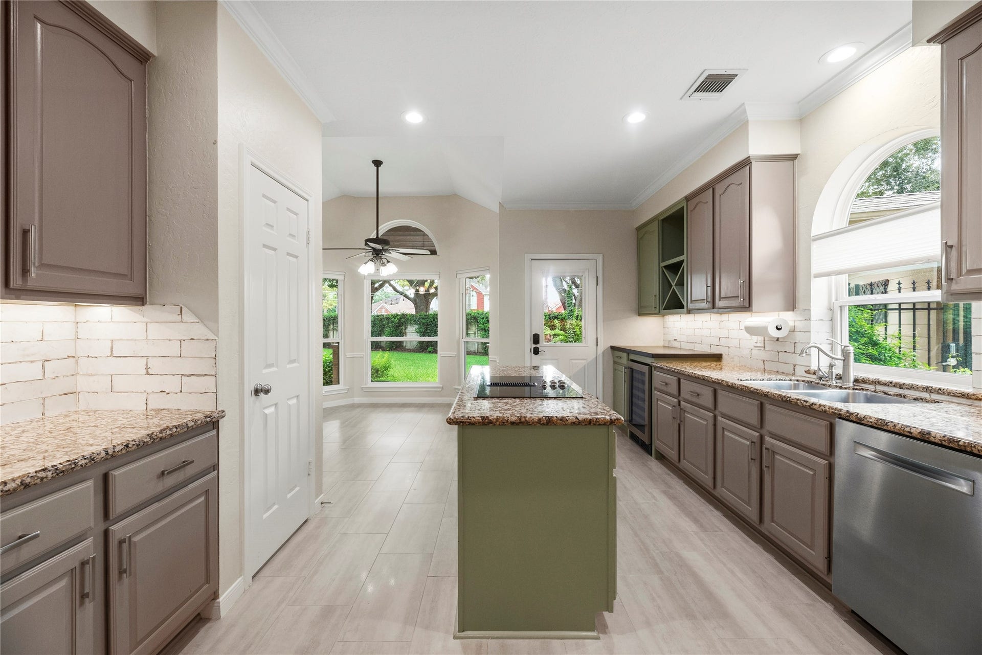 Spacious kitchen featuring granite countertops, abundant cabinetry, and modern appliances.