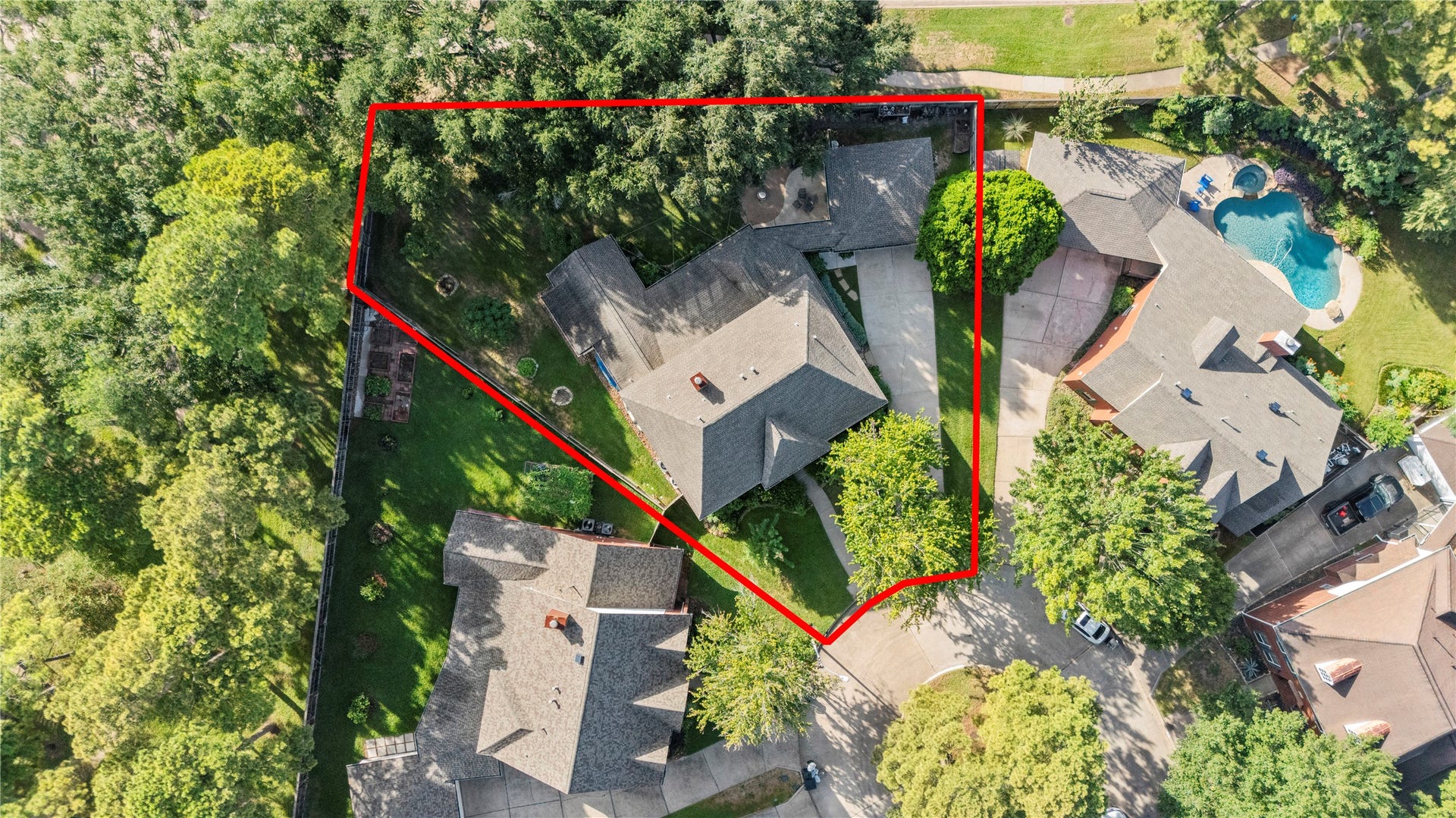 Expansive property nestled on a spacious, tree-lined lot, offering privacy with no back neighbors and direct gate access to trails and a park area.