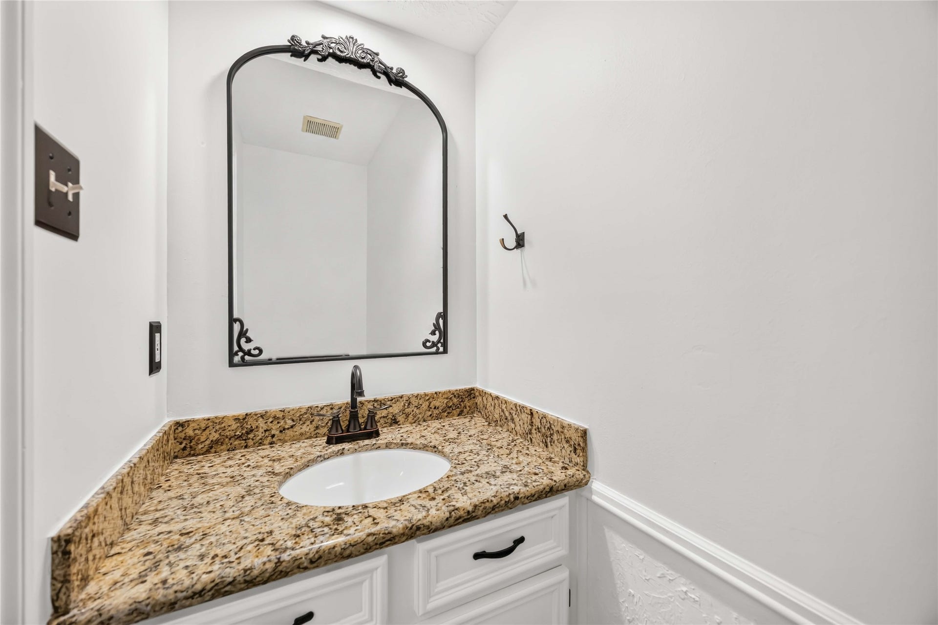 17006 Butteroak Drive, Spring, TX 77379 The conveniently located half bath offers a polished space for guests.