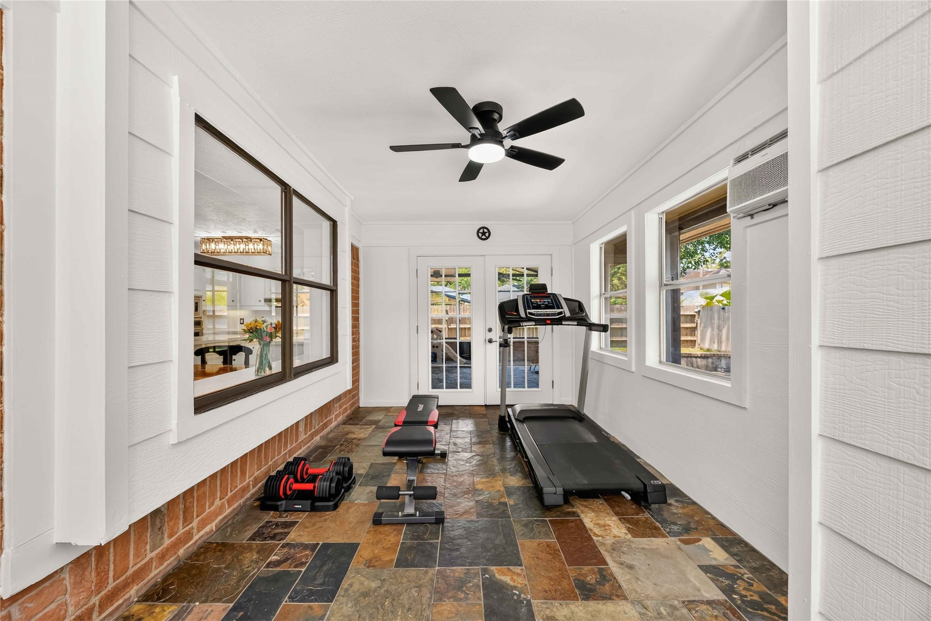 17006 Butteroak Drive, Spring, TX 77379 Extend your living space into the enclosed patio, perfect for relaxing, hobbies or enjoying the outdoors with added comfort.