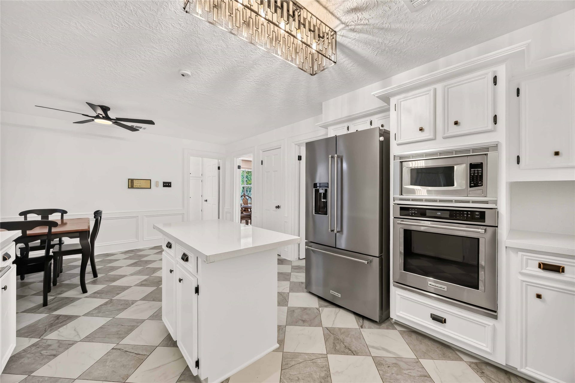 17006 Butteroak Drive, Spring, TX 77379 The kitchen combines a center island, stainless steel appliances and generous storage for a practical everyday cooking experience
