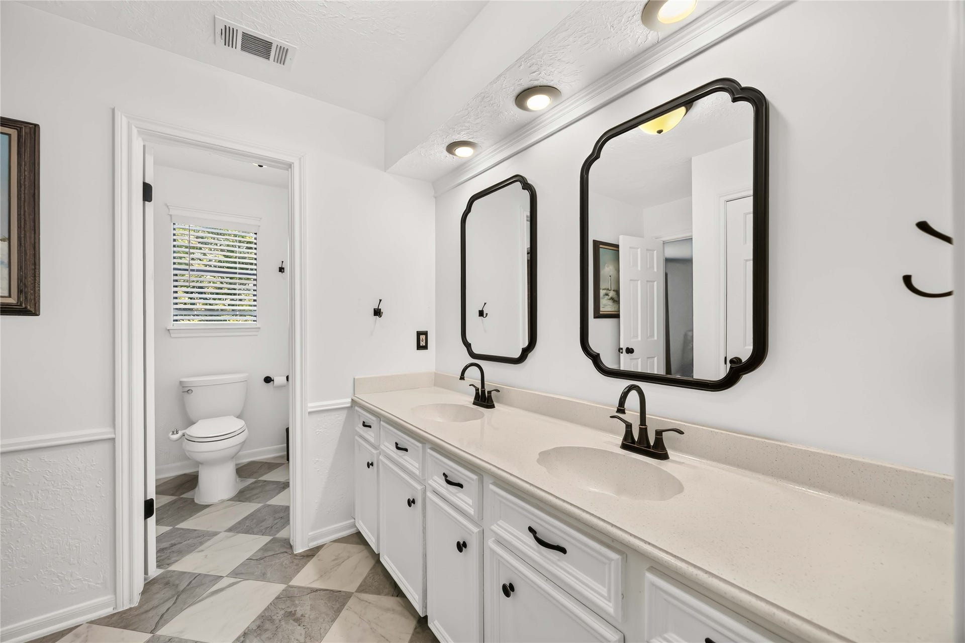 17006 Butteroak Drive, Spring, TX 77379 The upstairs bathroom features
a long dual-sink vanity, helping
make shared routines more convenient.