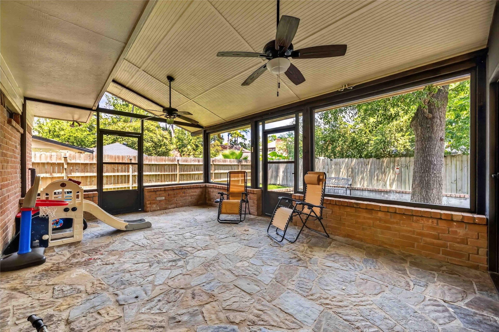 17006 Butteroak Drive, Spring, TX 77379 Enjoy the outdoors with added shade and protection in the screened porch, ideal for morning coffee or relaxed evenings.