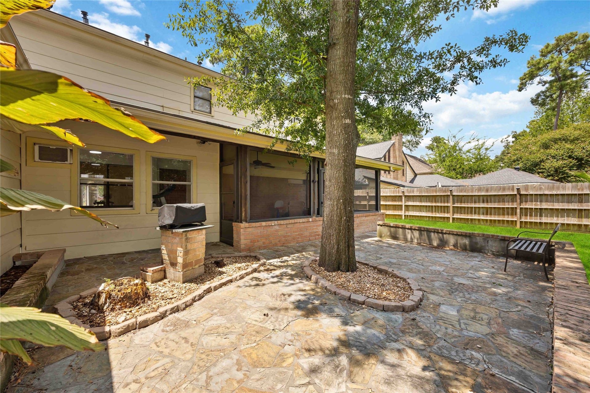 17006 Butteroak Drive, Spring, TX 77379 Create your favorite outdoor gathering spot on the patio with
space for dining, grilling and relaxing beneath the mature trees.