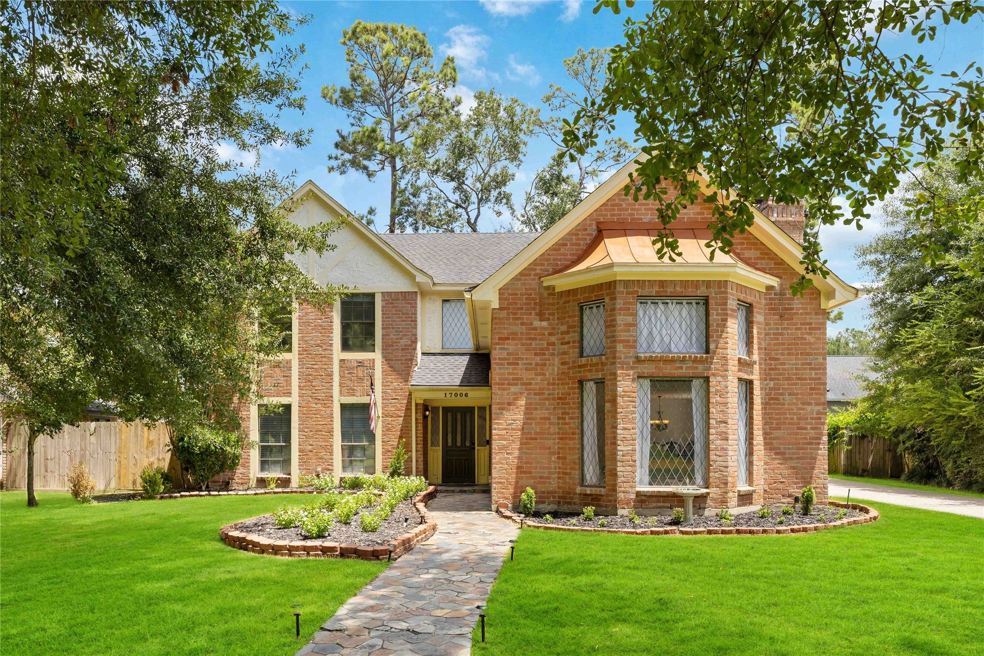 17006 Butteroak Drive, Spring, TX 77379 A classic brick exterior, established landscaping and a
welcoming front approach create
an inviting first impression.
