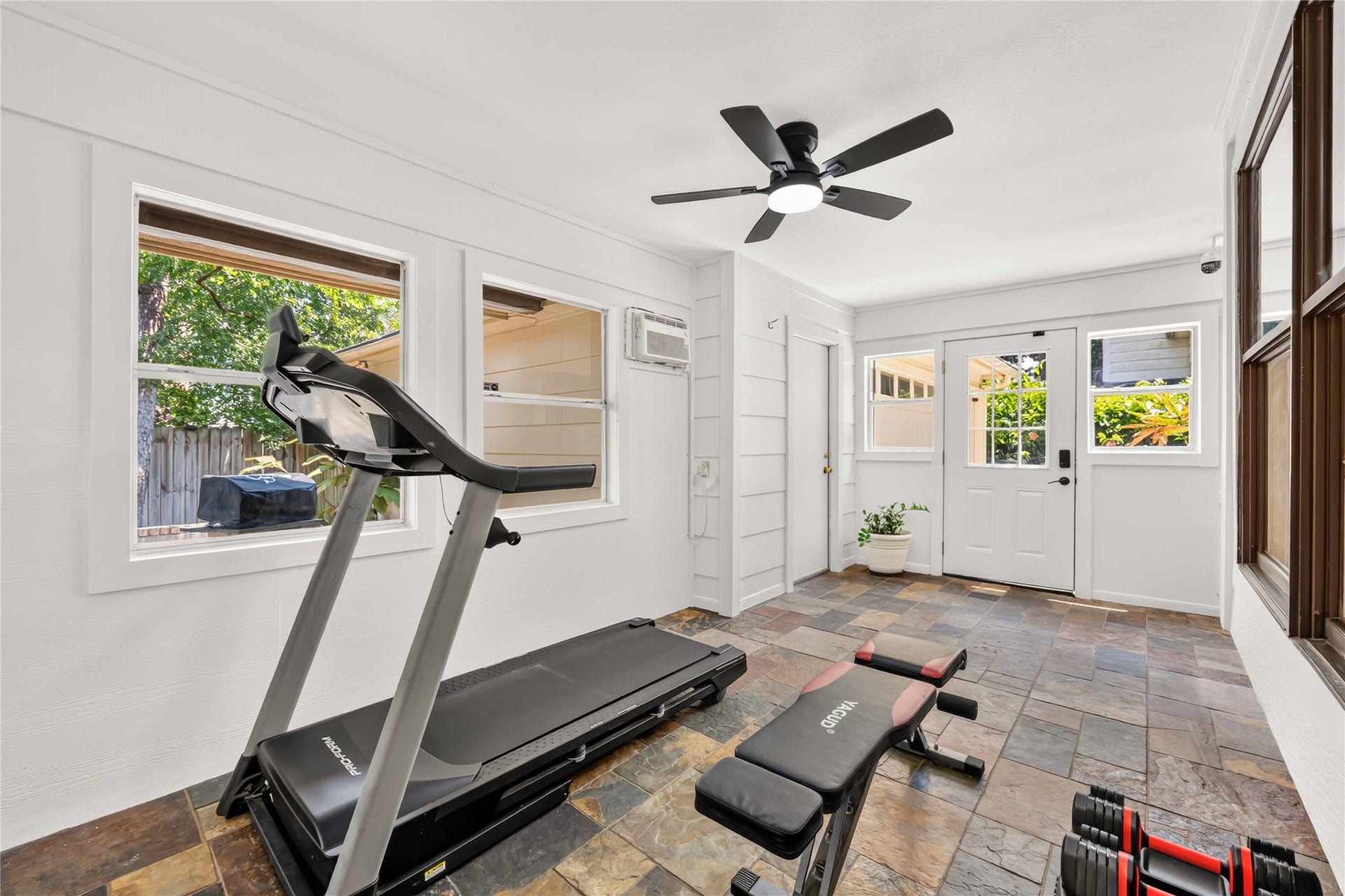 17006 Butteroak Drive, Spring, TX 77379 The enclosed patio offers flexible space for a home gym, hobby room or additional sitting area
surrounded by natural light.